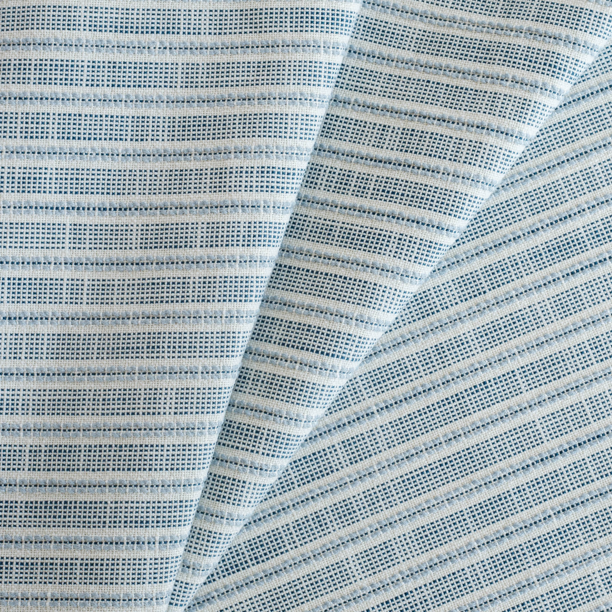 Amalfi Stripe InsideOut Fabric Indigo, a white, indigo and chambray blue stripe outdoor performance fabric from Tonic Living