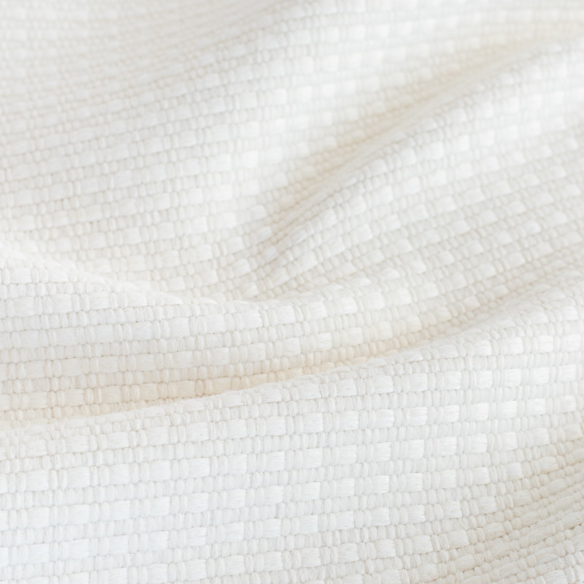 Arlo Fabric Salt, a white basket weave textured stain resistant upholstery fabric from Tonic Living