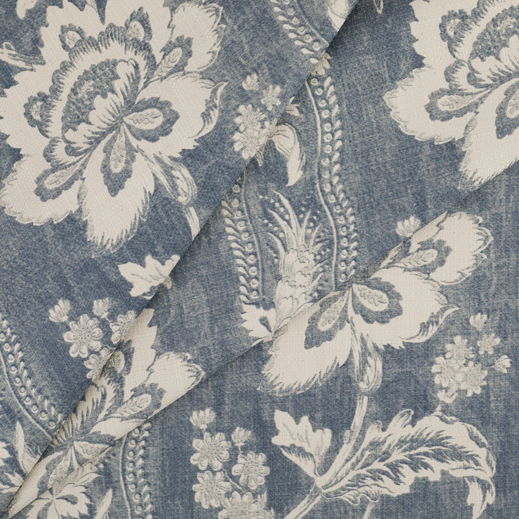 Tonic Living Ashford Denim fabric featuring scrolling floral vines forming a subtle stripe pattern.