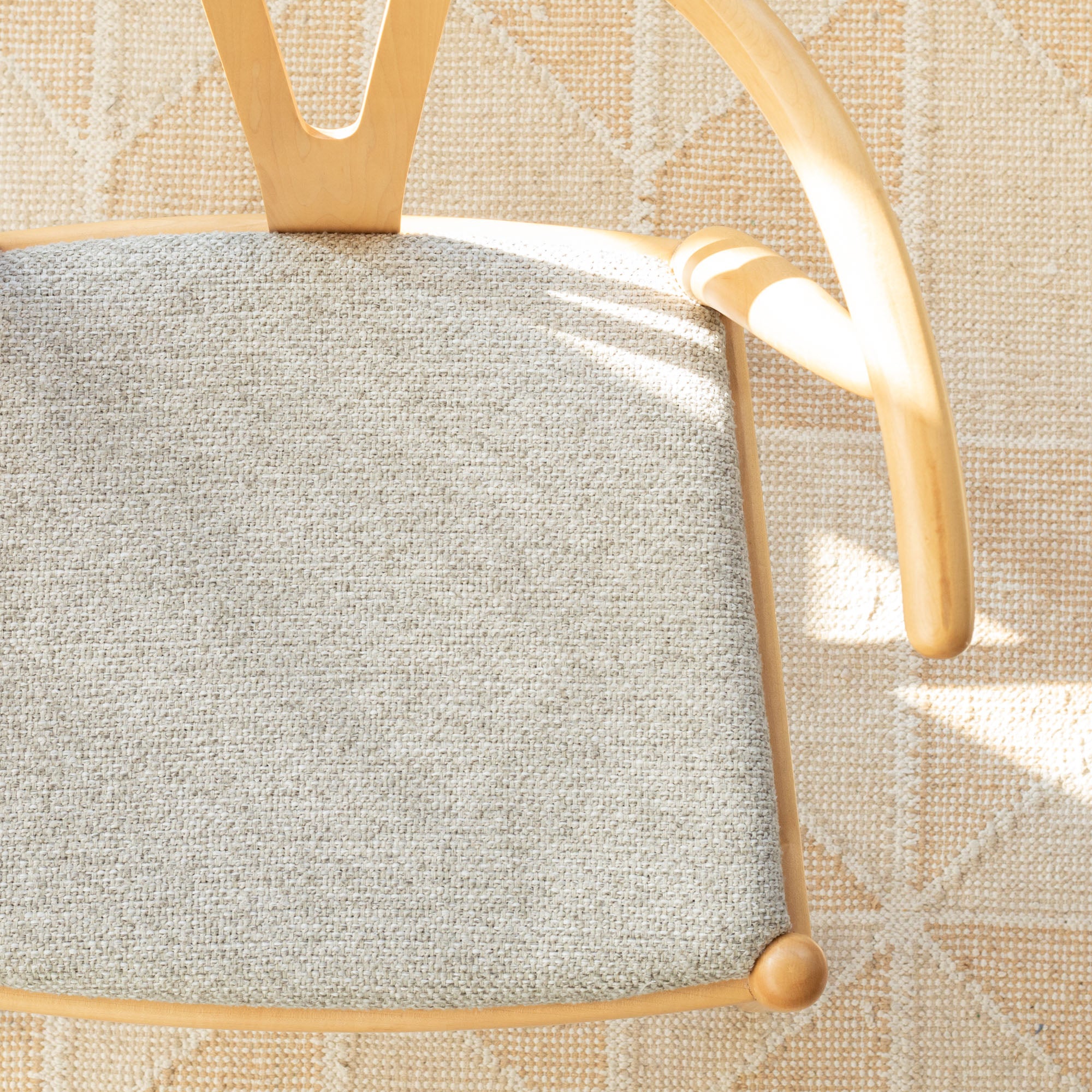 a warm grey upholstered chair seat