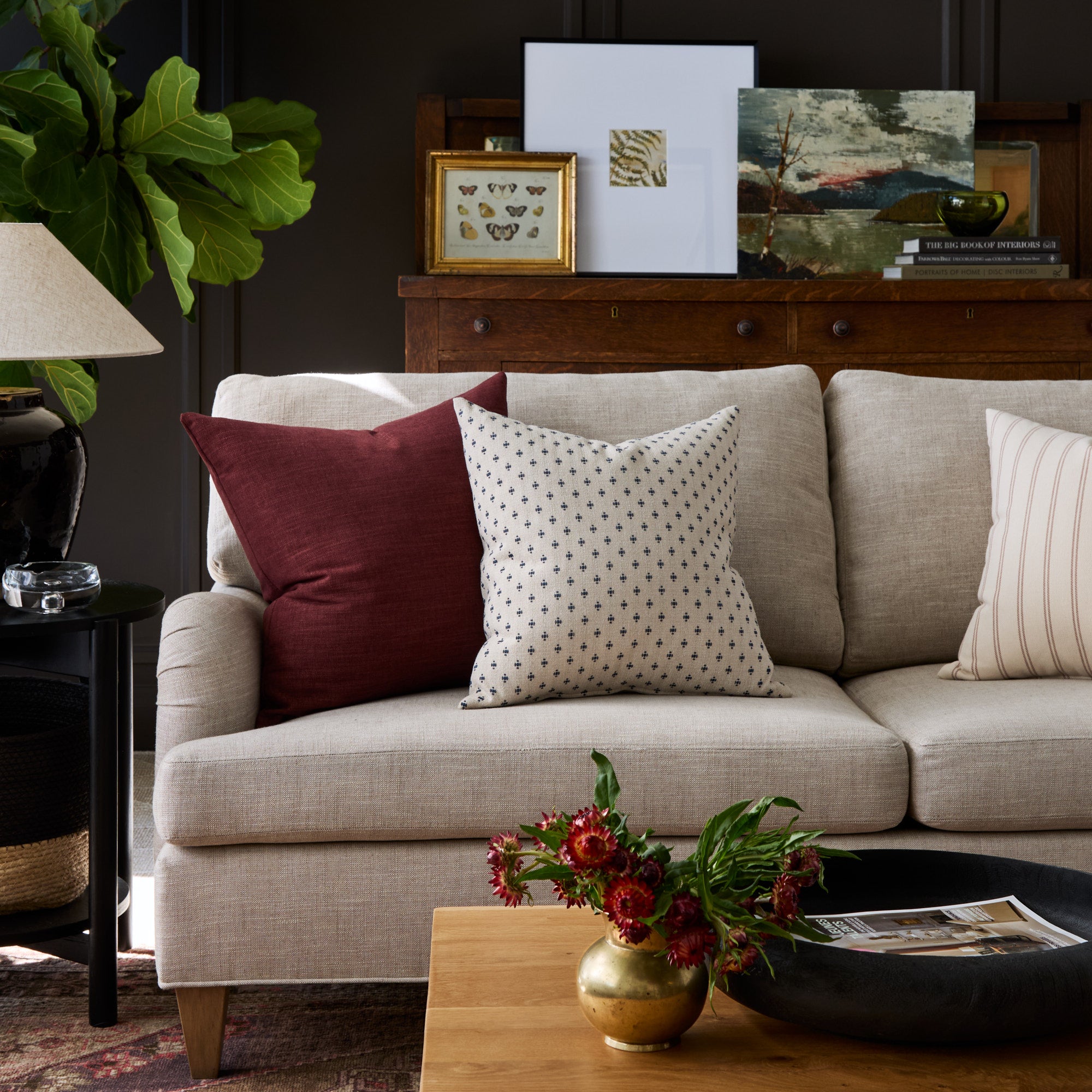Living room with Bedford Merlot burgundy and Pierce Navy blue pillows styled on a sofa – Tonic Living