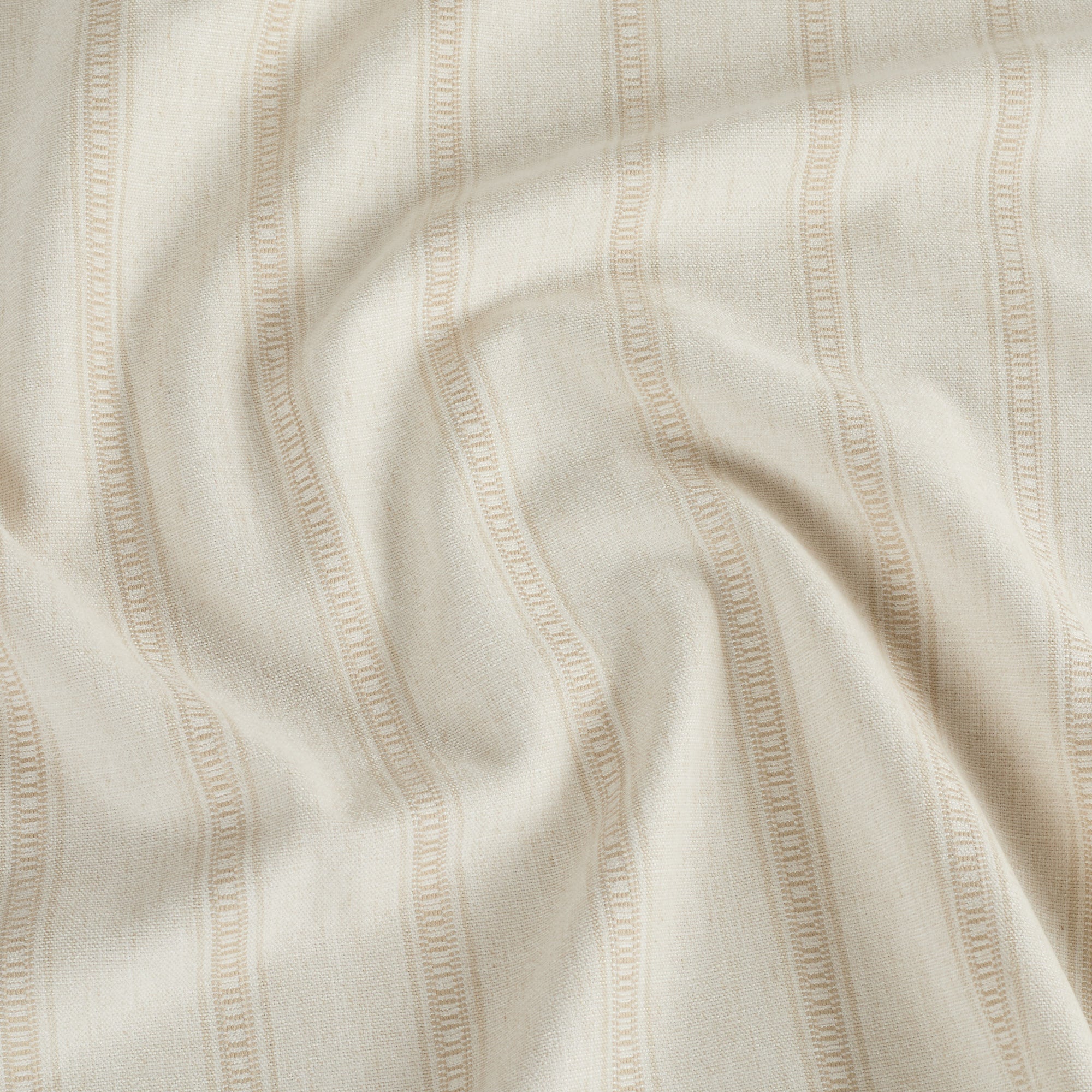 Tonic Living Brunswick Stripe neutral fabric in Parchment shown for timeless, easy-to-layer style.