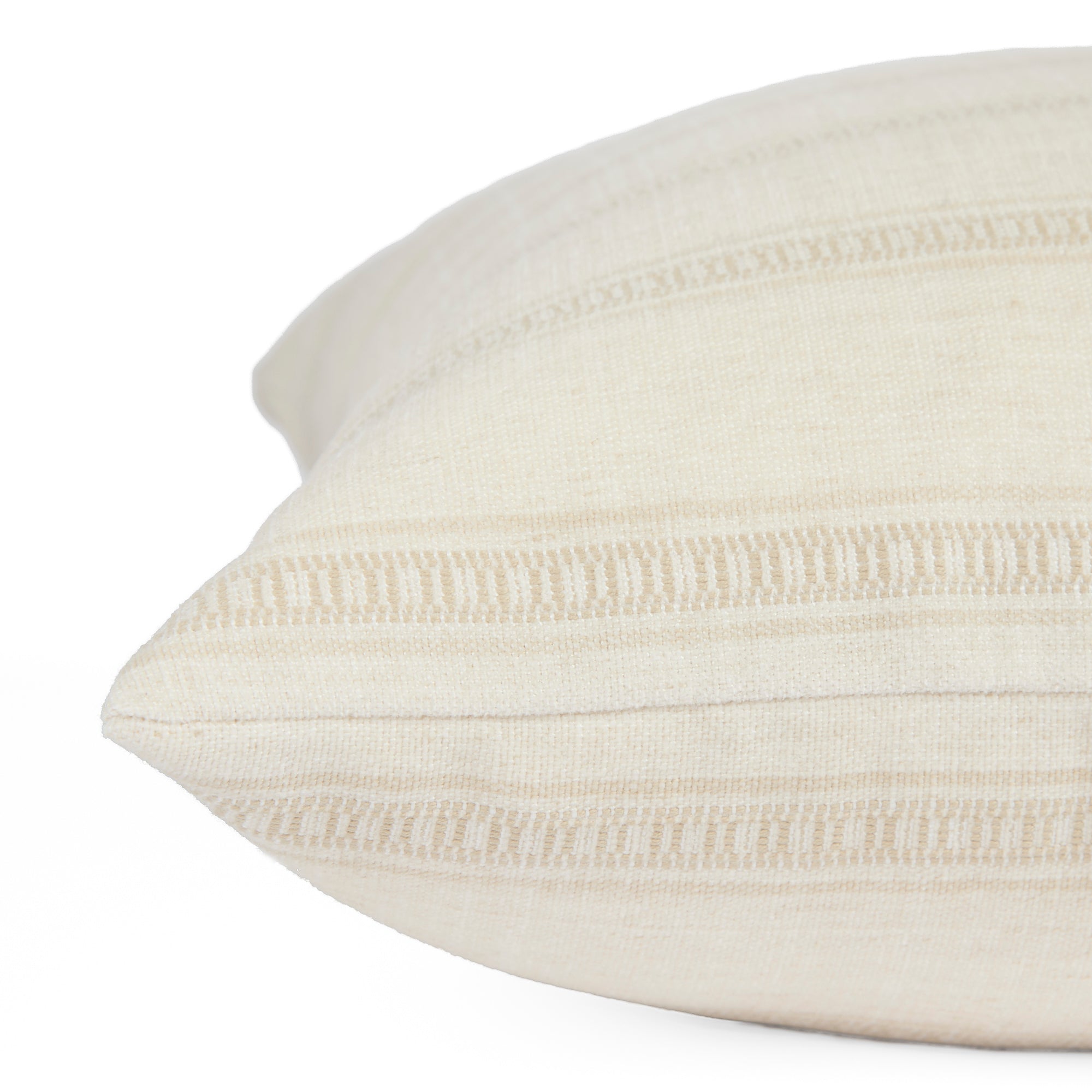 Side view close up of Tonic Living Brunswick Stripe off-white throw pillow highlighting its soft stripe texture.