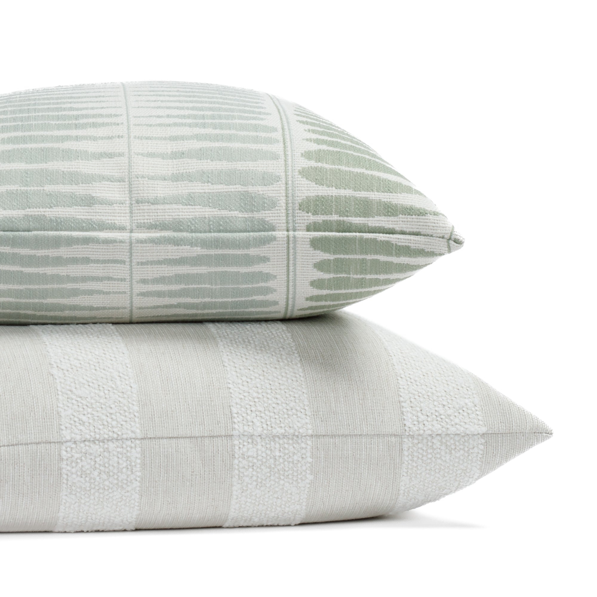 Two neutral and soft green patterned indoor/outdoor pillows from Tonic Living.