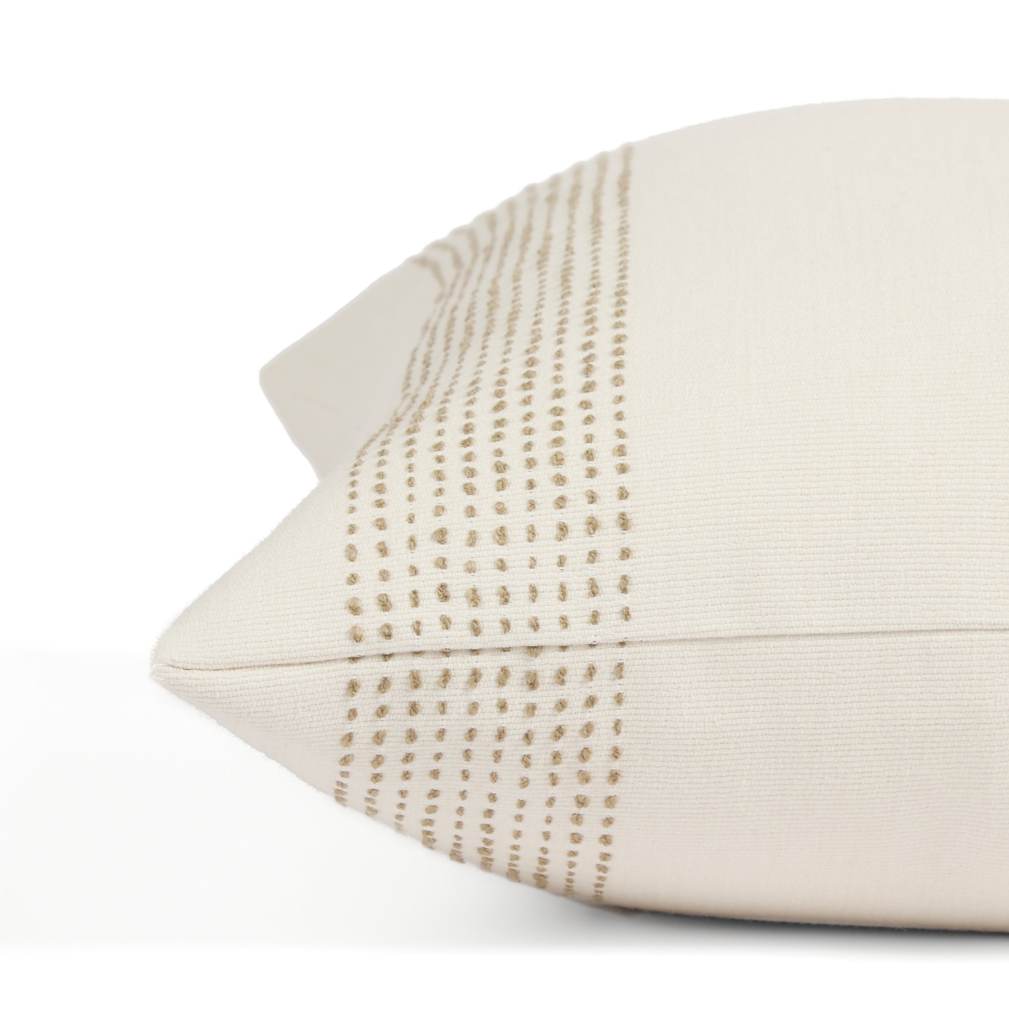 Close up of Tonic Living Caper outdoor cushion showing off-white and light brown dotted stripe detail.