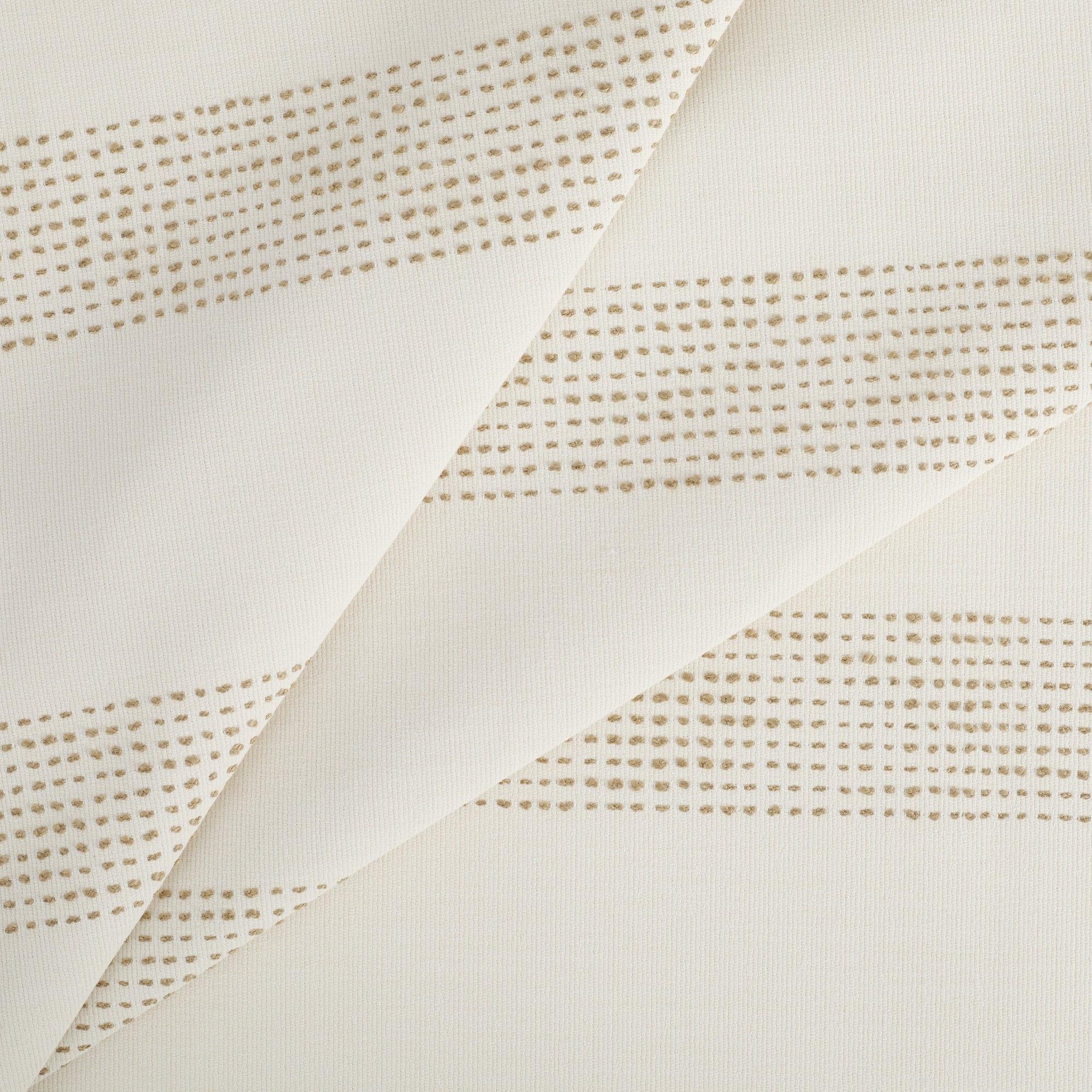 Tonic Living Caper Sunbrella Linen indoor/outdoor upholstery fabric with soft beige and tan banded stripe.