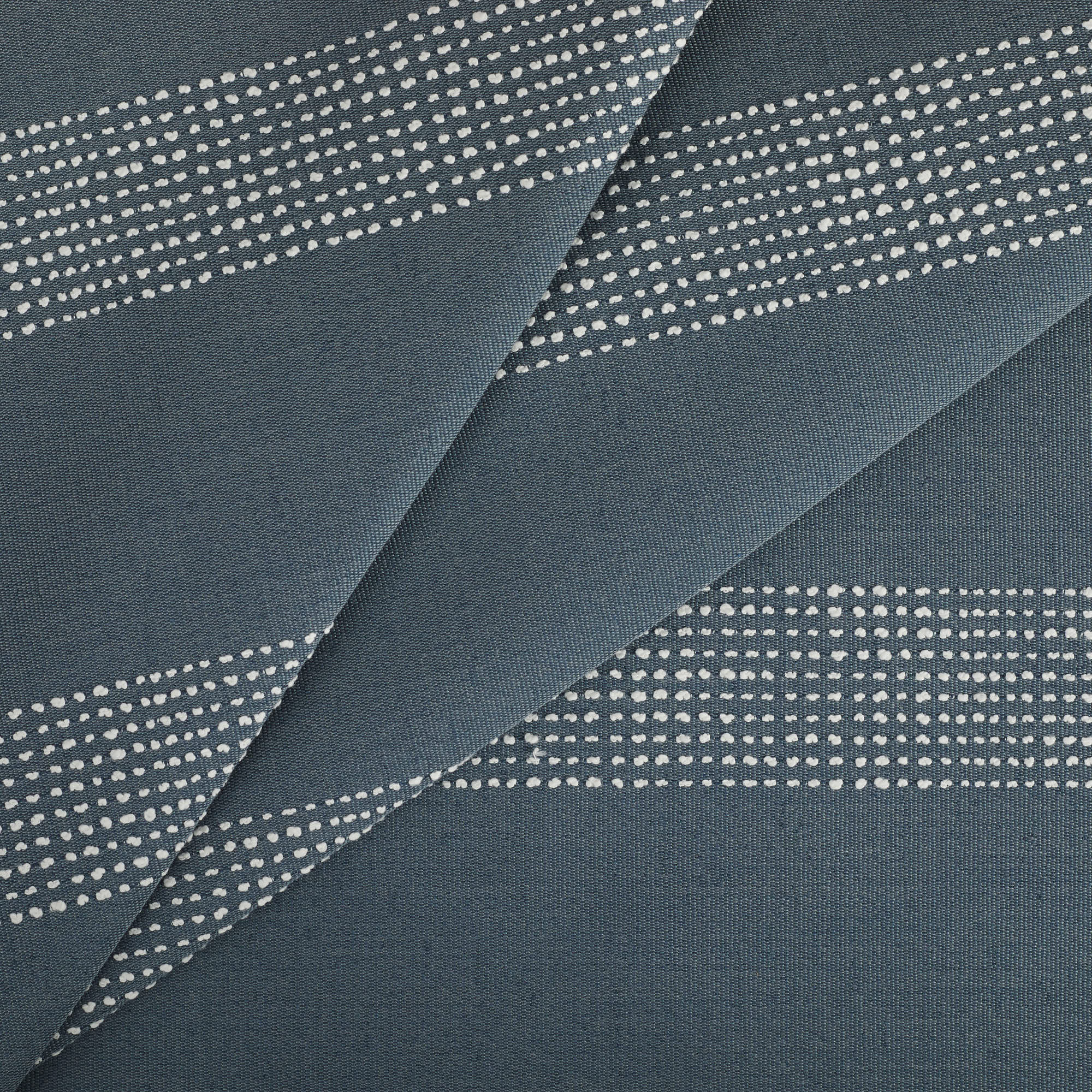 Tonic Living Caper Sunbrella Slate performance fabric featuring embroidered stripe in blue and white tones.