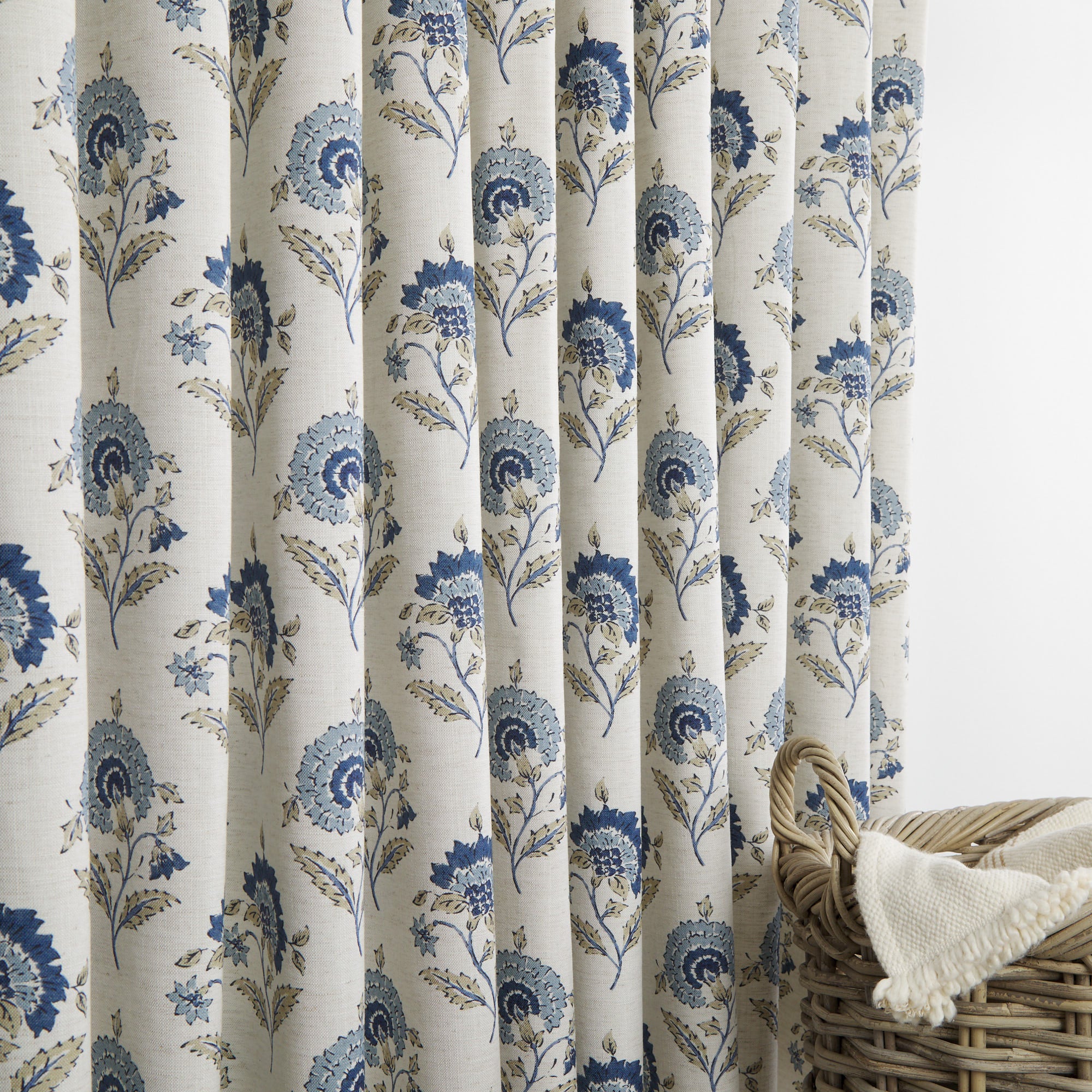 Tonic Living Clara Denim curtain fabric shown as full drapery in blue and white floral print.
