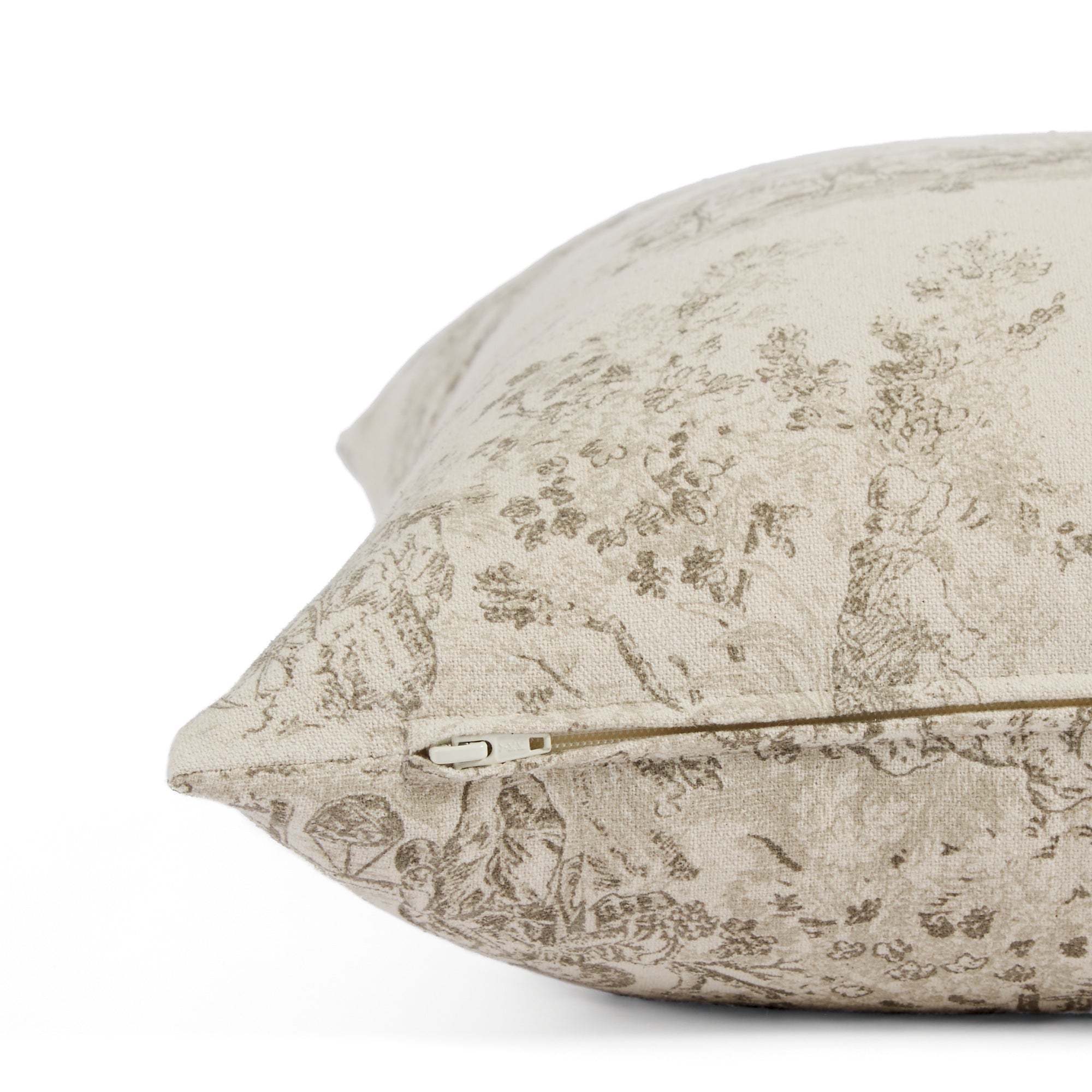 Side zipper detail of Tonic Living Colette 20x20 throw pillow in brown and natural toile print.