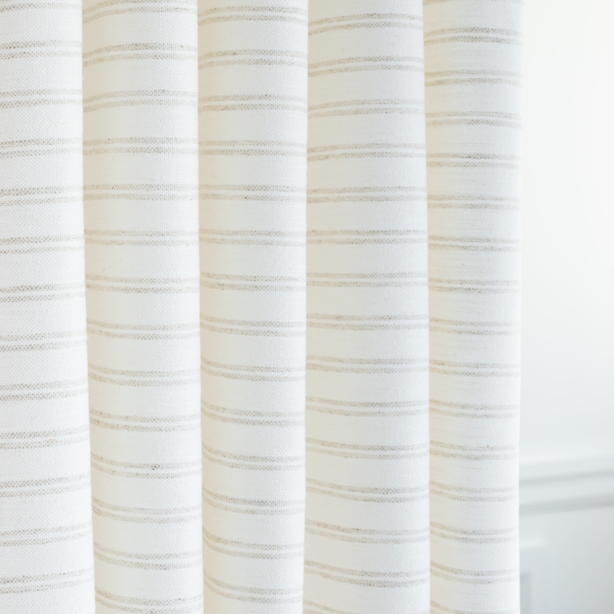 a white and beige grey stripe drapery fabric