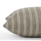 Detailed side close-up of the Conway Stripe Sage 12x24 lumbar pillow from Tonic Living, emphasizing the vertical stripe pattern and soft, organic colour mix of sage green and oatmeal.