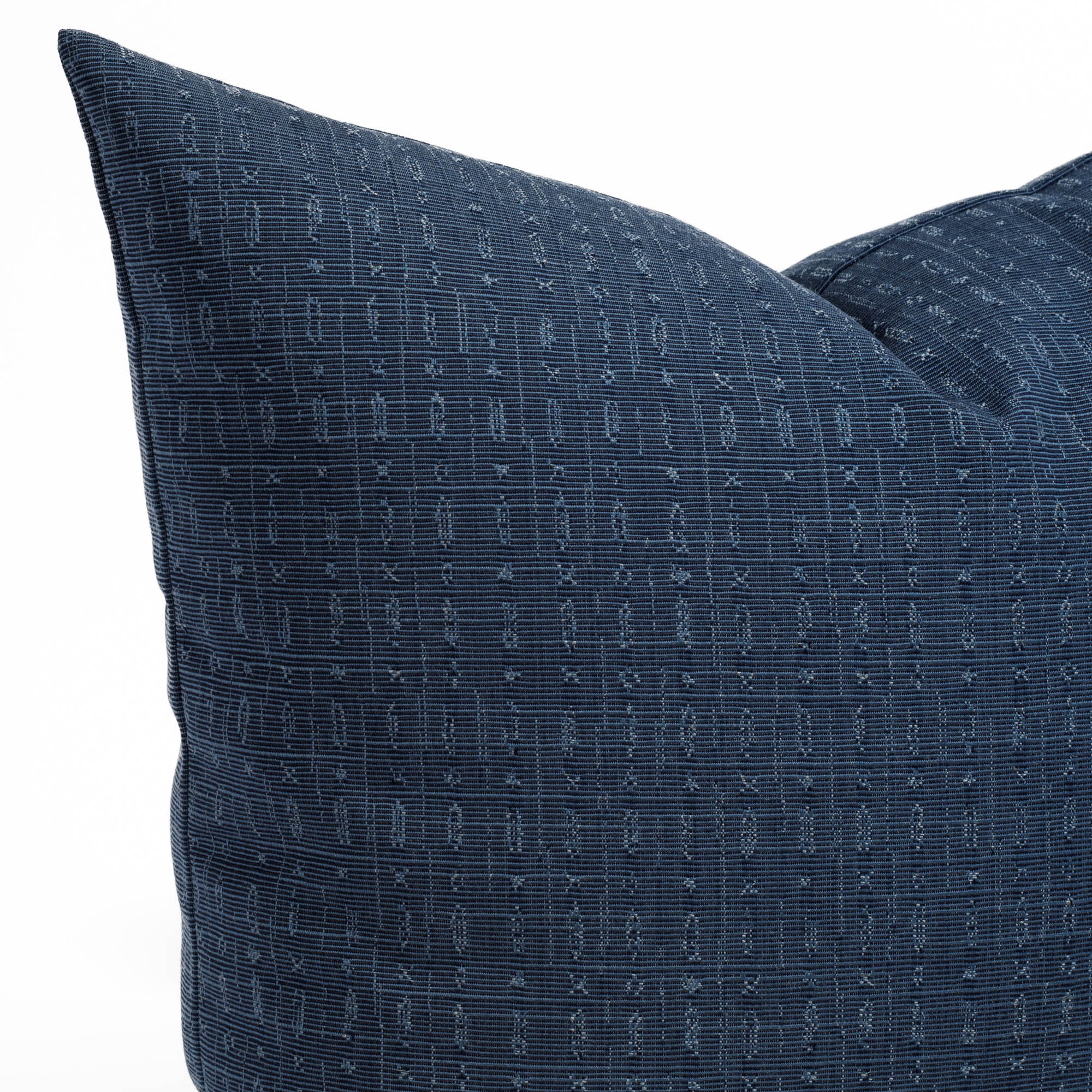 Embrace Indigo, a navy textured indoor/outdoor pillow from Tonic Living: close up view.