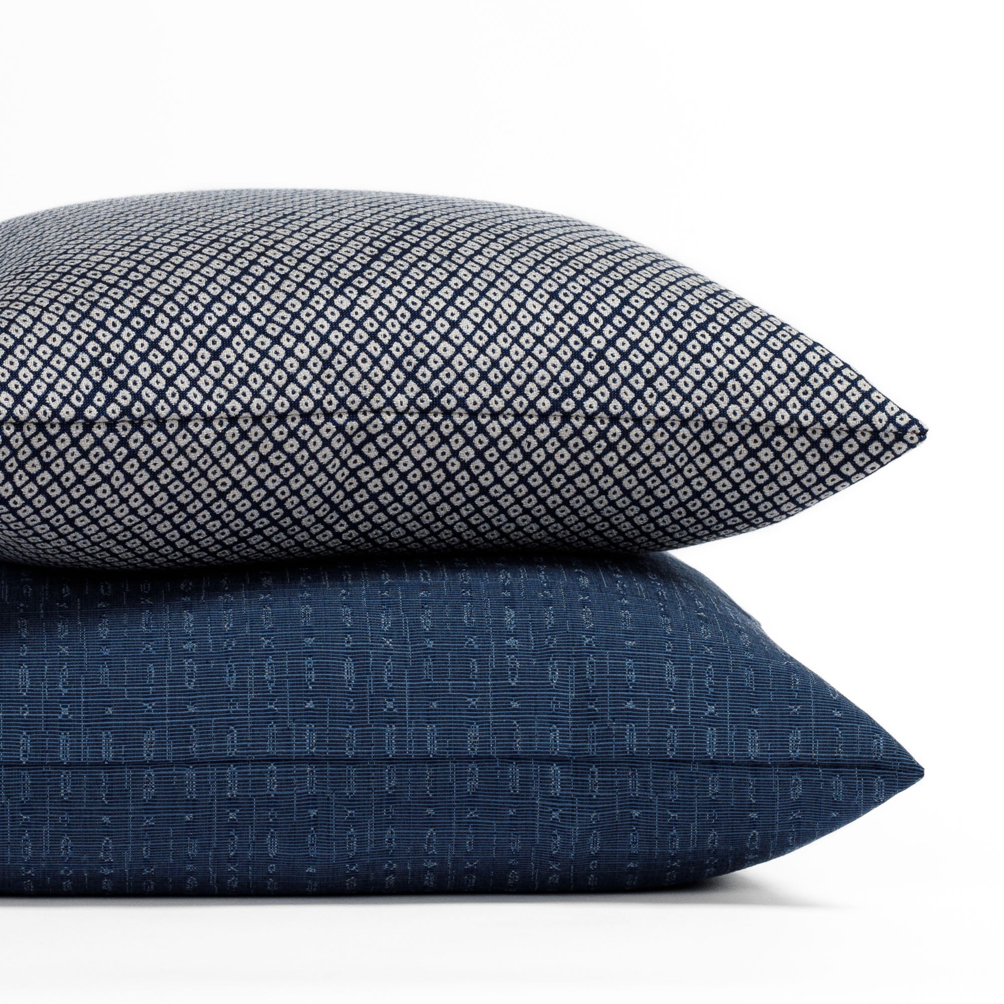 Two blue patterned indoor/outdoor pillows from Tonic Living.