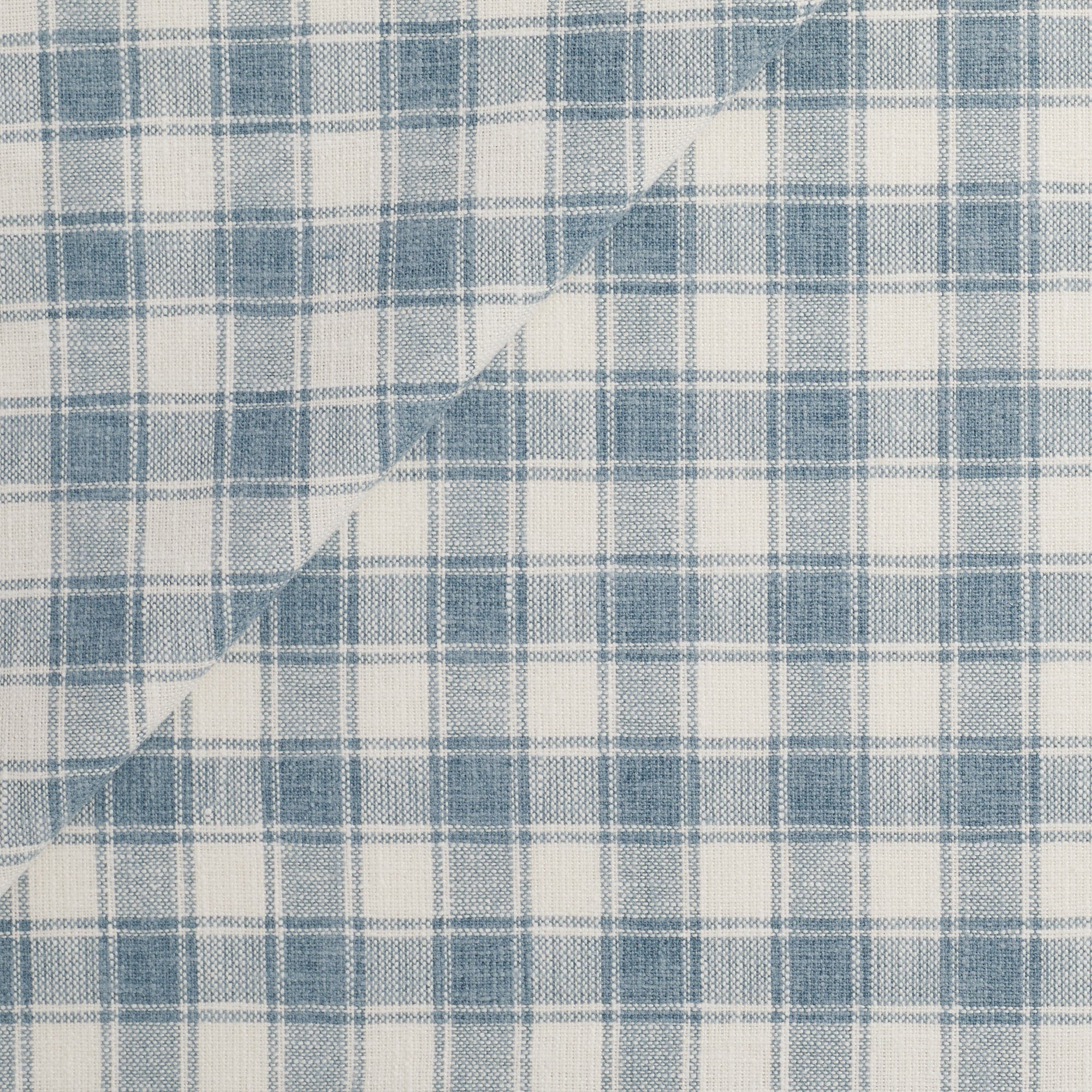 Tonic Living Emmett Plaid Fabric in Denim Blue featuring a timeless blue and white plaid for upholstery and drapery.
