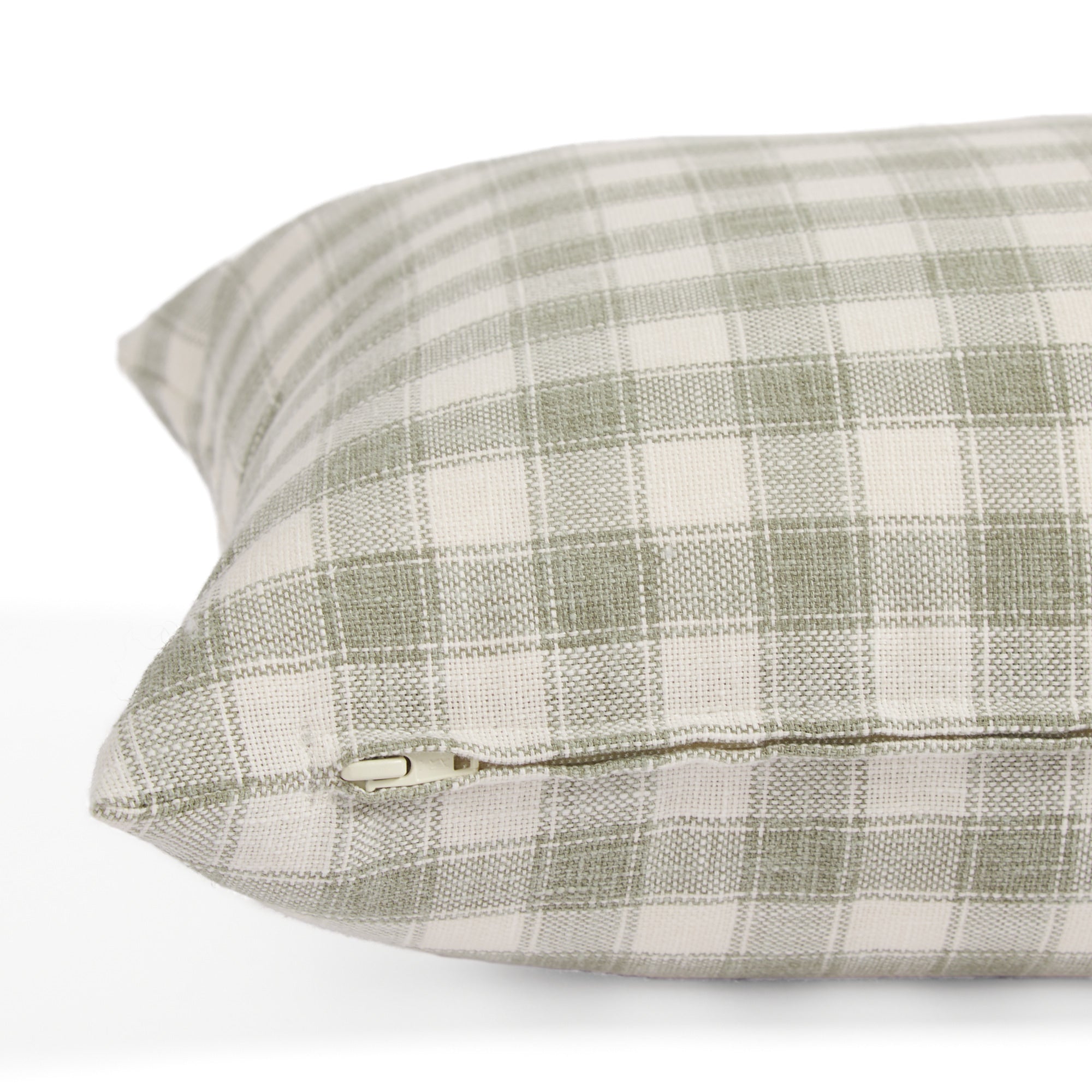 Side zipper detail of Tonic Living Emmett Plaid 14x20 pillow in light green and white plaid.
