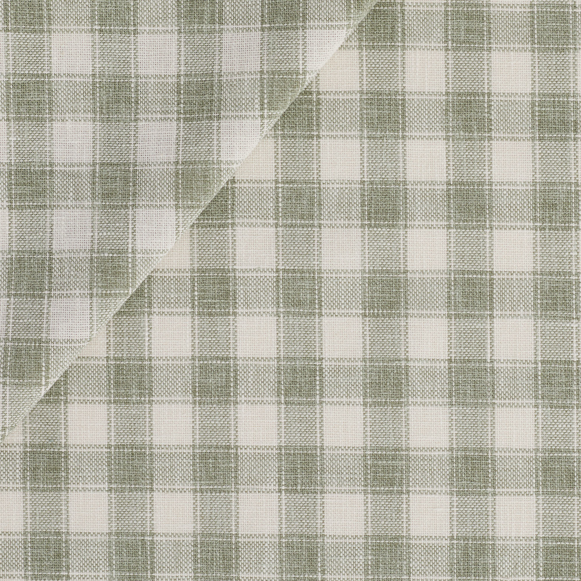 Tonic Living Emmett Plaid Fabric in Sage featuring a fresh green and white plaid for upholstery and drapery.