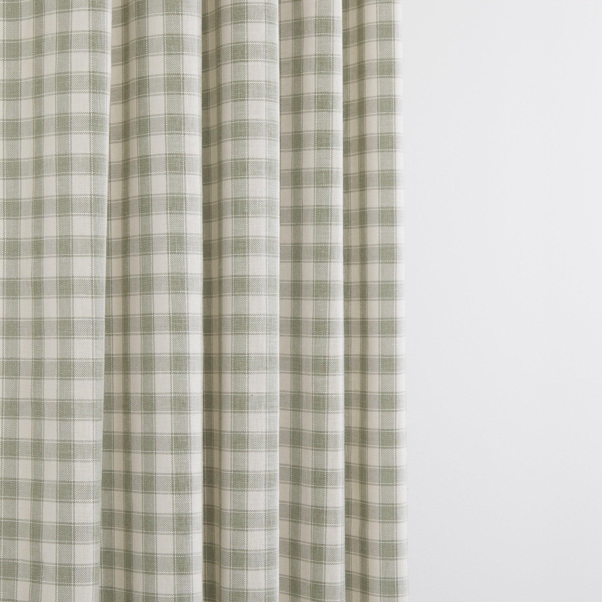 Tonic Living Emmett Plaid Sage fabric suitable for curtains and window treatments in a classic green check.