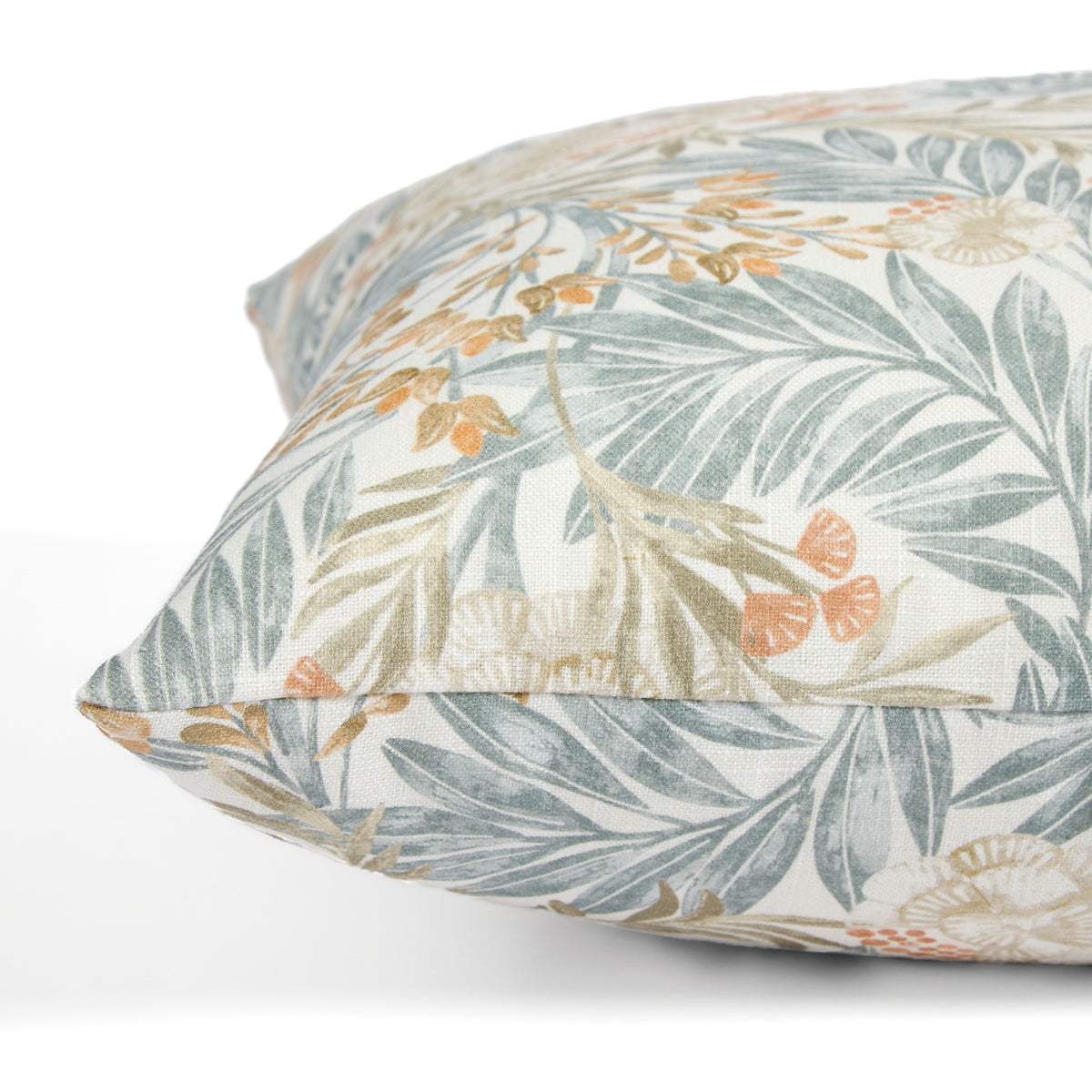 Side view of Tonic Living Fable Meadow decorative cushion highlighting its colourful leafy botanical and floral pattern.