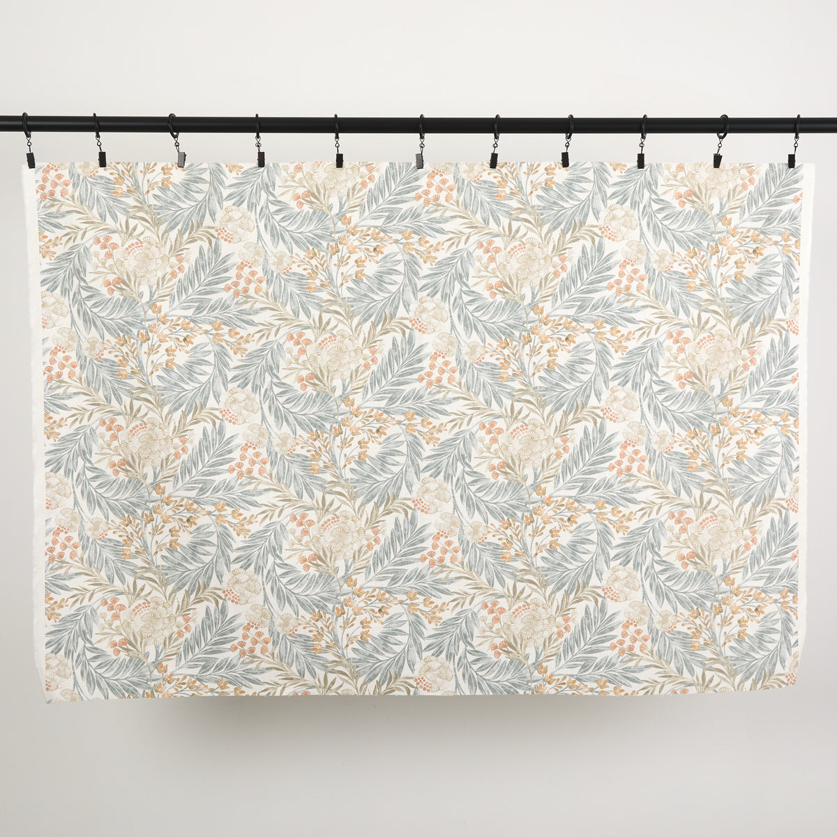 Full yard of Tonic Living Fable Fabric in Meadow hanging to show the scale and drape of its multicolour botanical pattern.