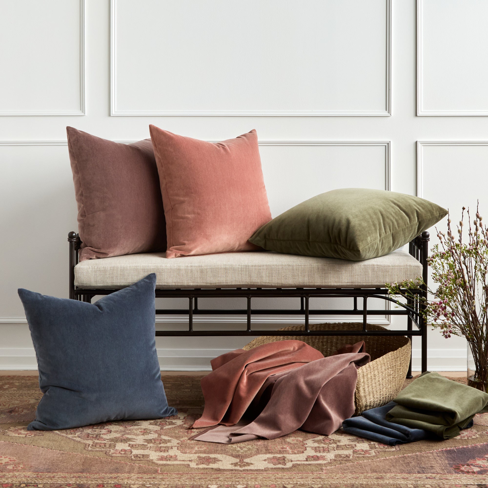 Tonic Living Florence Velvet pillow and fabric collection in pink, green, blue, and dusty purple tones.