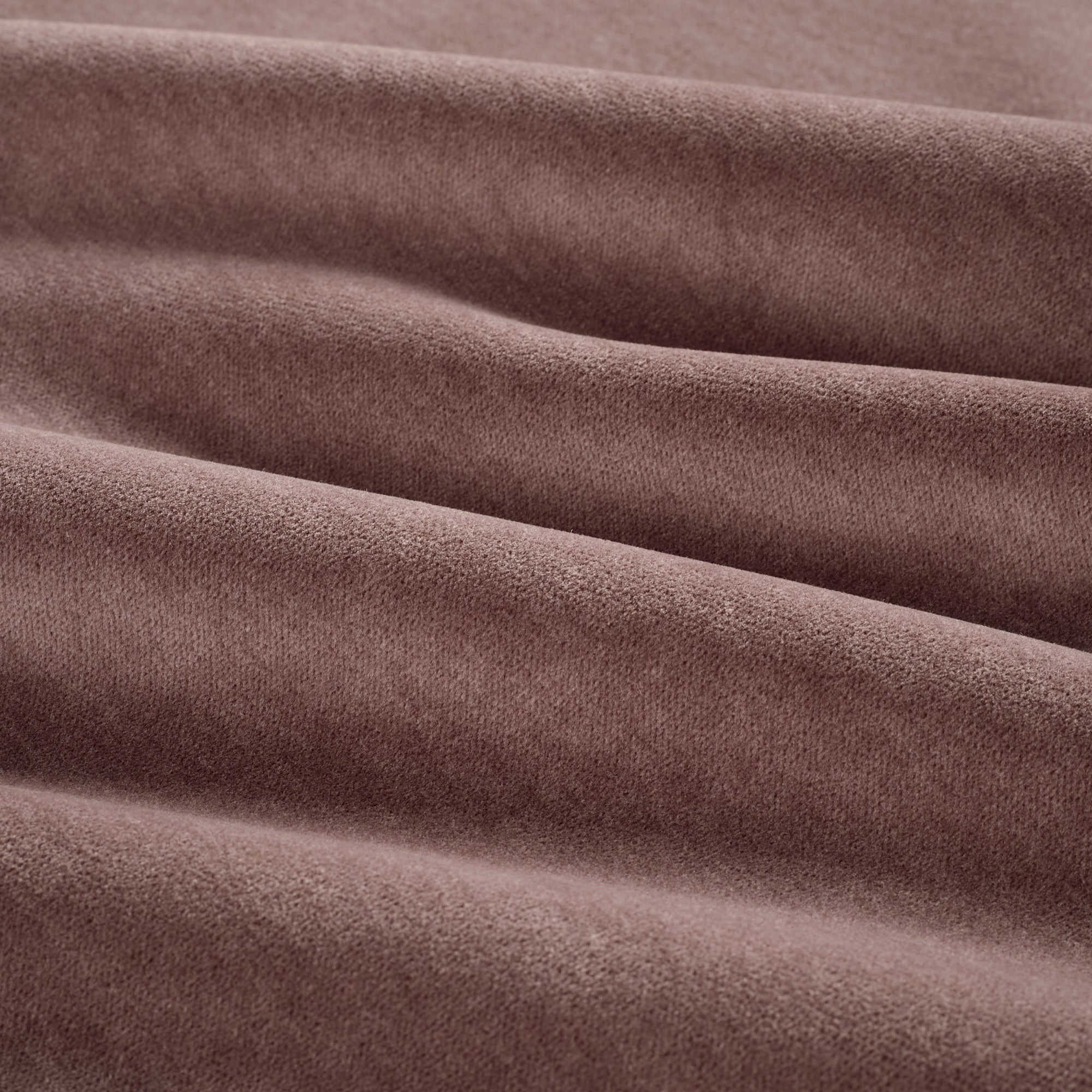 Close up of Tonic Living Florence Velvet Mauve upholstery fabric showing its plush dusty purple texture.