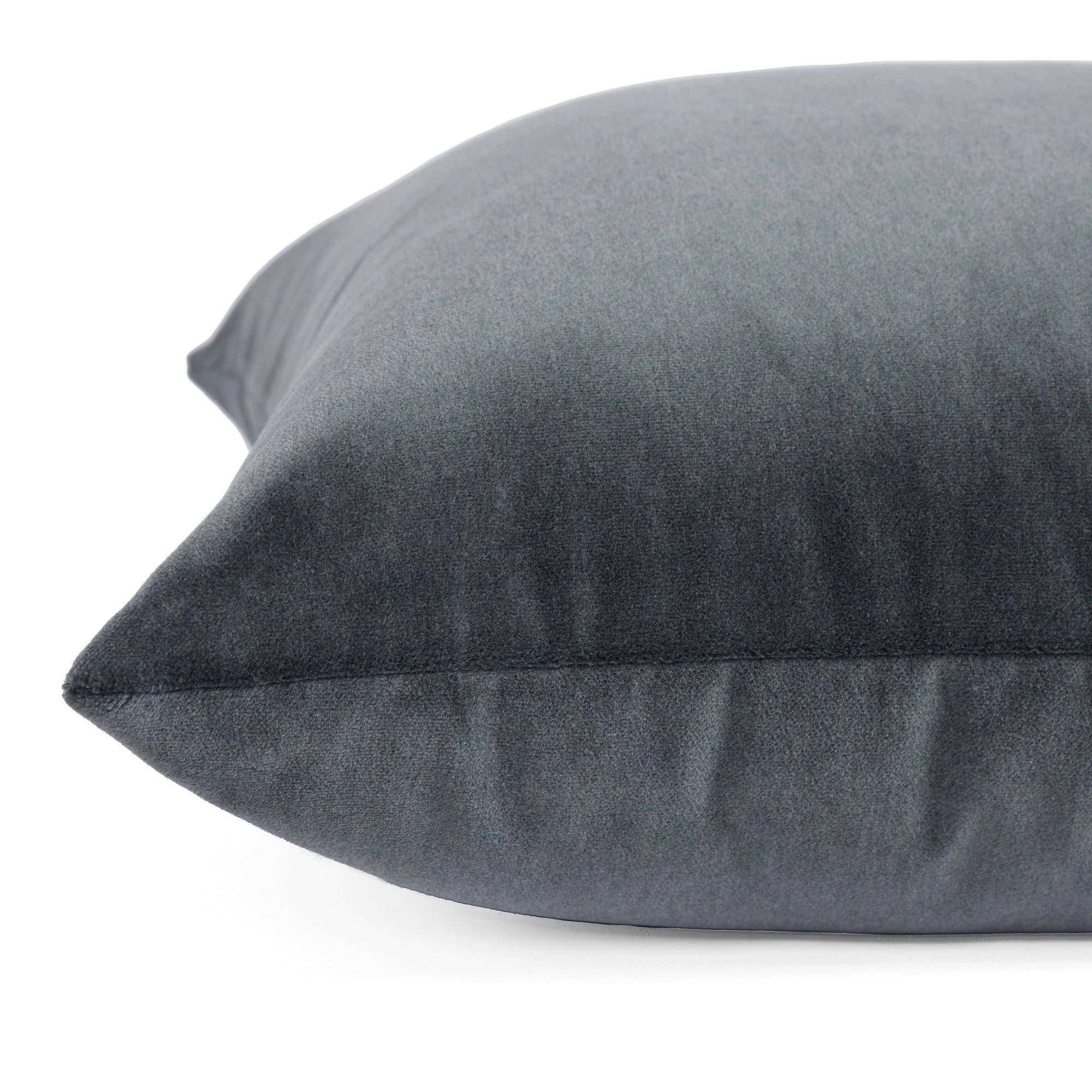 Side zipper detail of Tonic Living Florence Velvet 22x22 pillow in Mineral Blue.