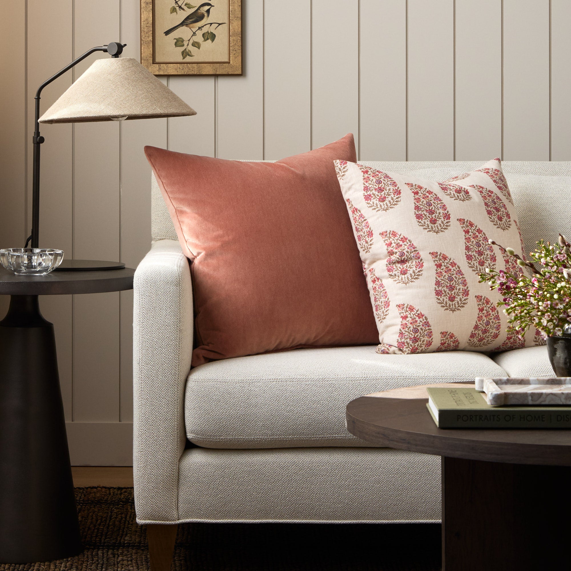 Tonic Living Florence Velvet Rosewood throw pillow styled on a sofa with the Grace 20x20 pillow in Rosewood.