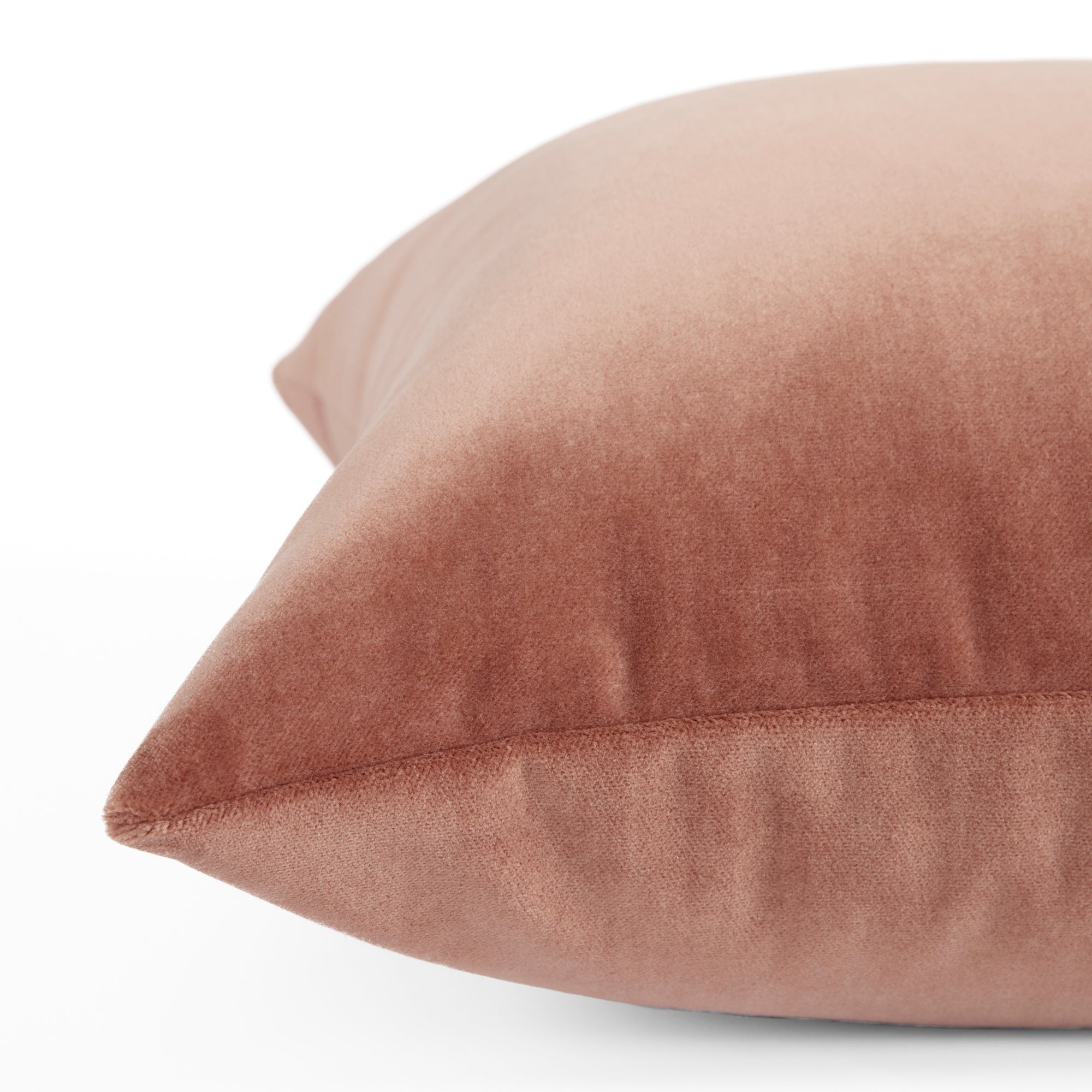 Side view of Tonic Living Florence Velvet decorative pillow in a muted antique pink velvet.
