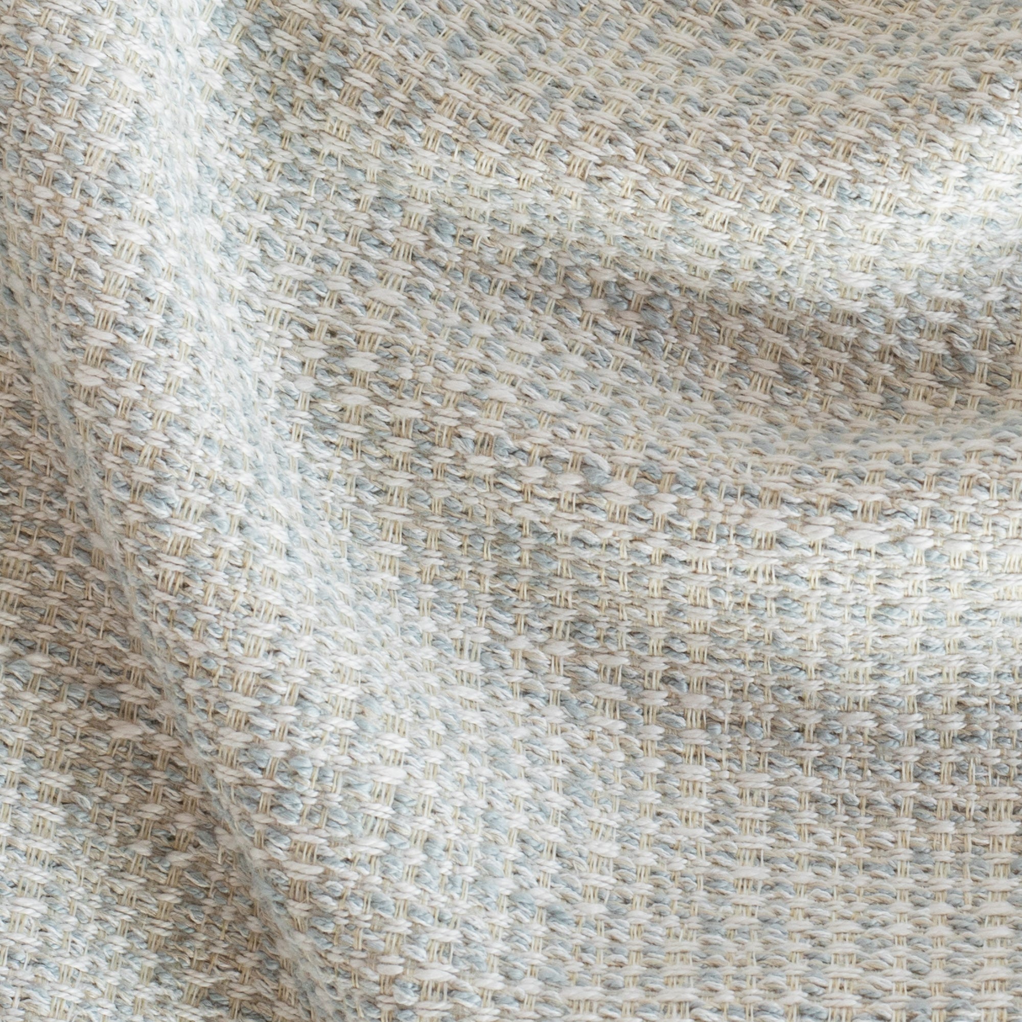 a cool sky blue tweedy textured outdoor fabric : close up view