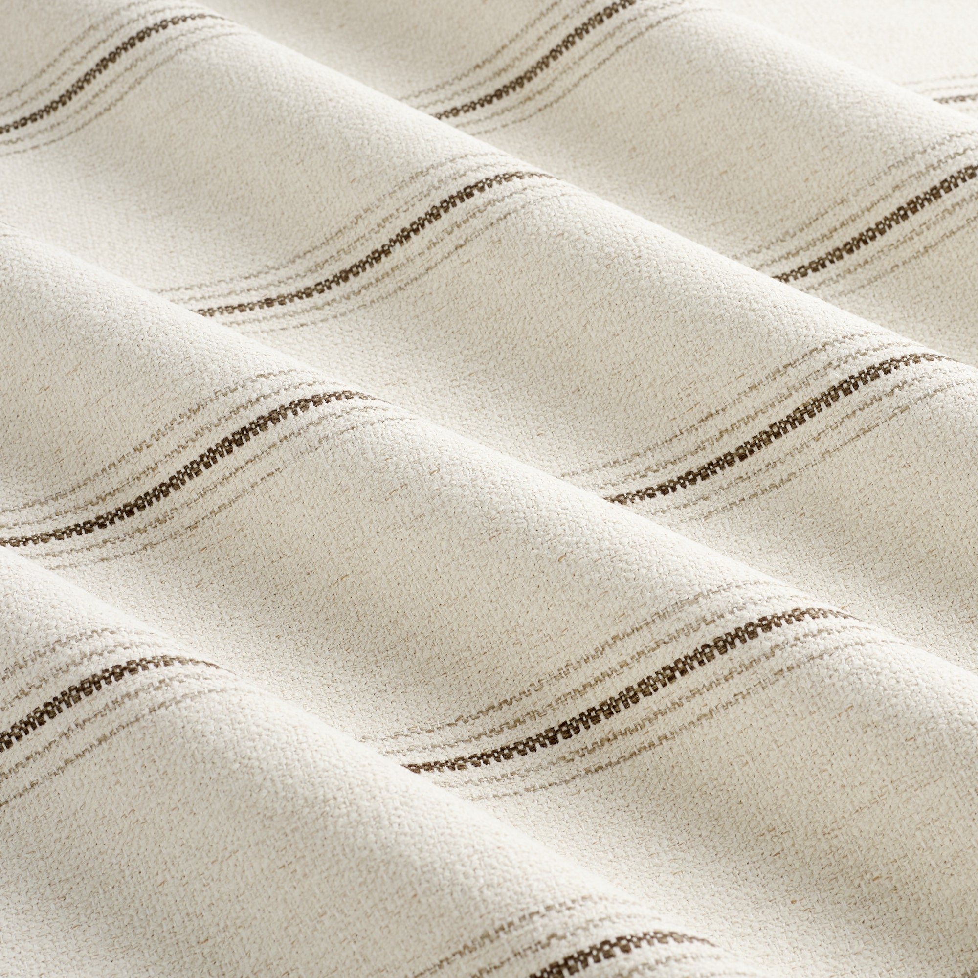 Tonic Living Gibson Stripe Fabric in Birch, a neutral high-performance striped fabric inspired by vintage European grain sack textiles.