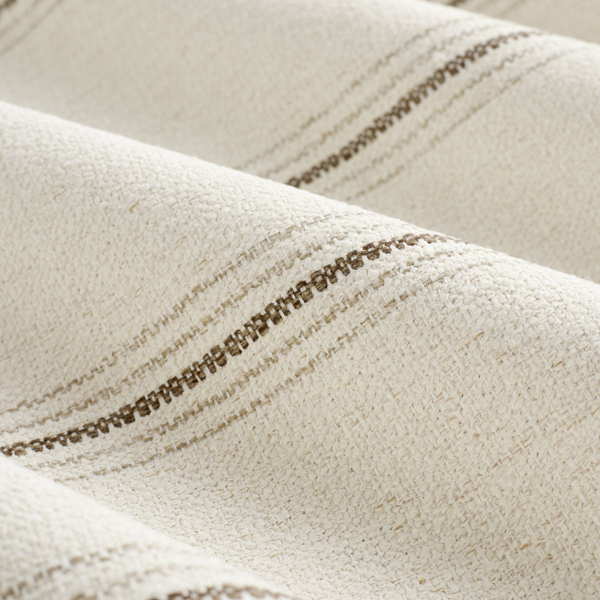 Close up of Tonic Living Gibson Stripe Birch fabric showing beige and brown ticking stripes with fine woven linear detail.
