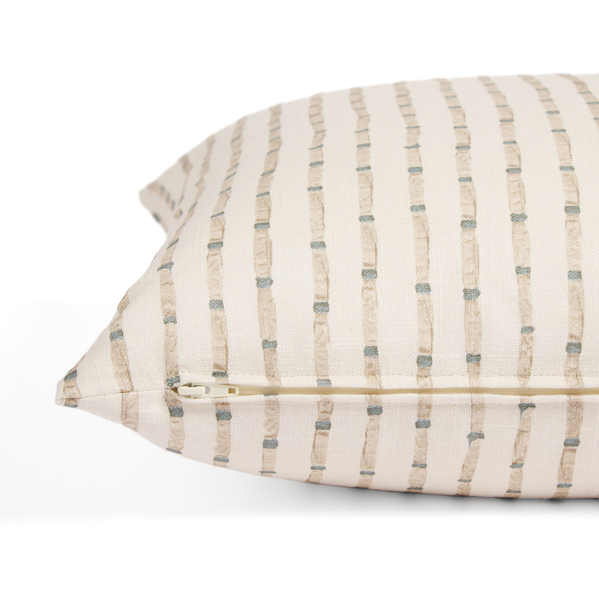 Side zipper detail of Tonic Living Hadley Stripe 20x20 throw pillow featuring blue and warm brown stripes on off-white.