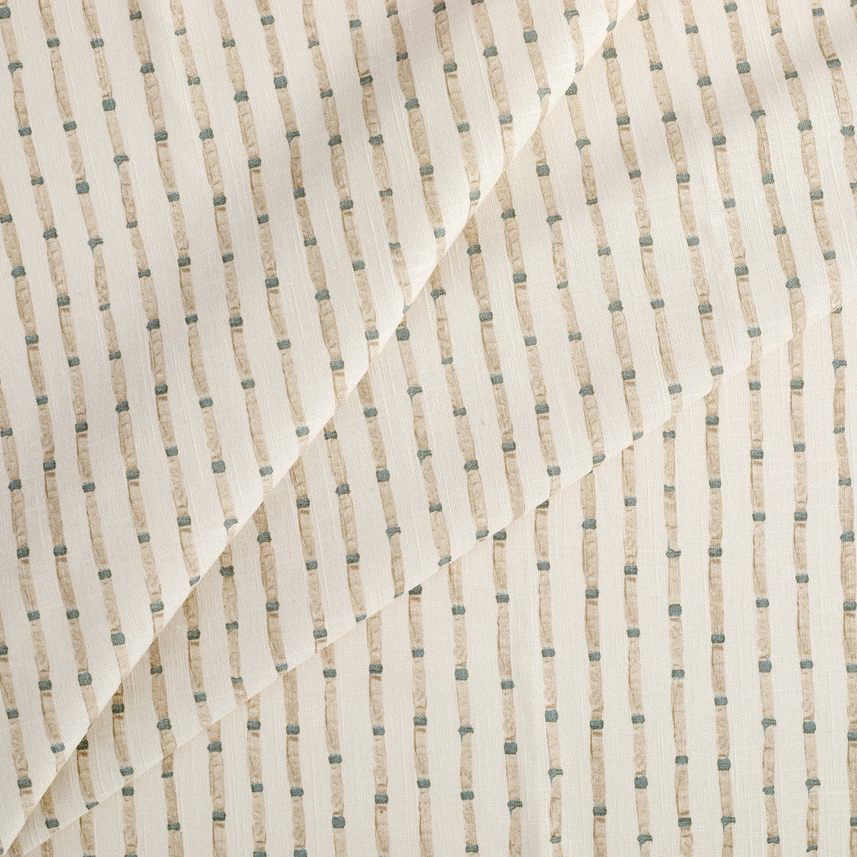 Tonic Living Hadley Stripe Fabric, a striped drapery fabric in off-white, light brown, and blue with a classic decorative design.