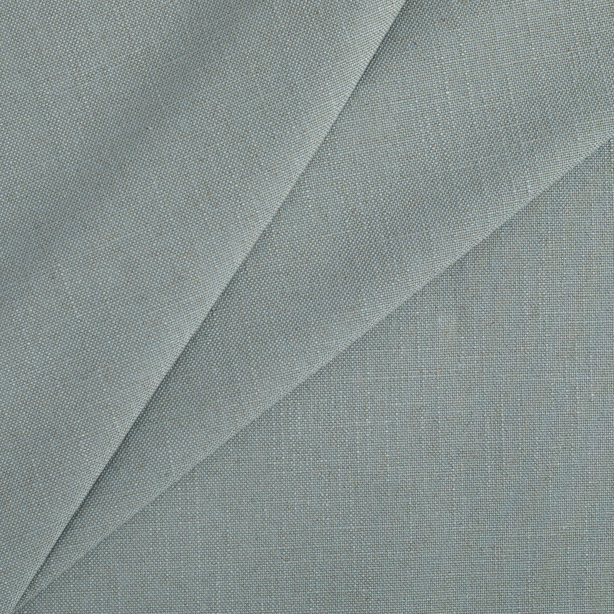 Tonic Living Hampton Chambray upholstery fabric featuring a light blue tone with Belgian linen look and feel.