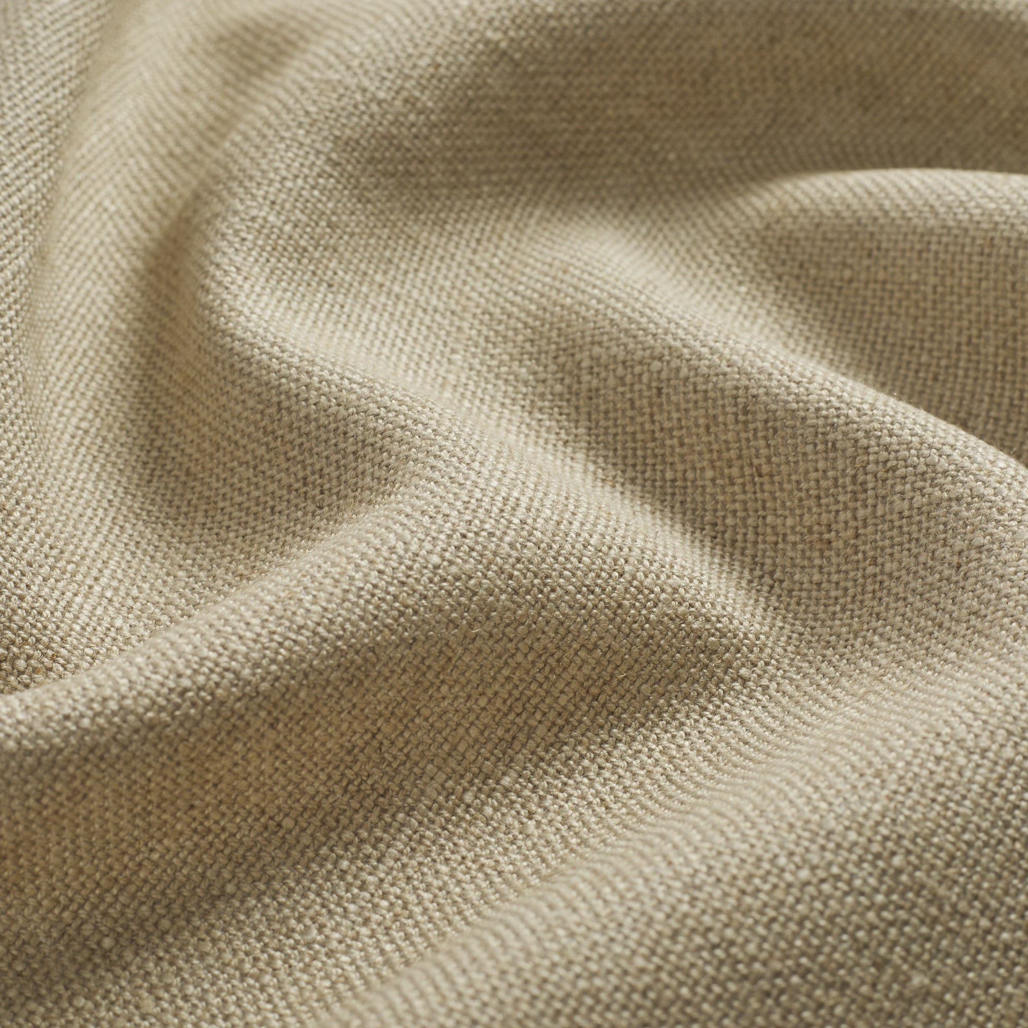 Close up of Tonic Living Hampton Flax fabric showing textured beige weave with a linen-inspired finish.