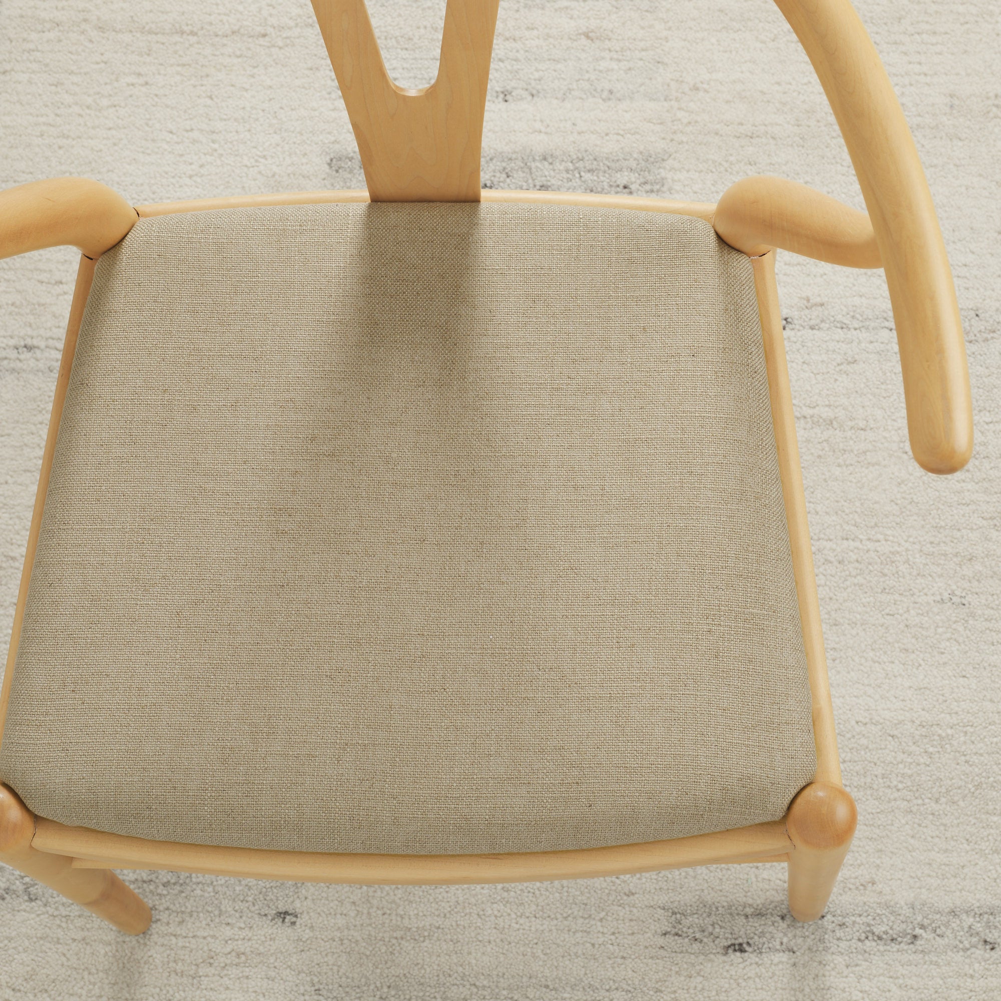 Tonic Living Hampton Flax high-performance upholstery fabric on a dining chair seat in soft beige linen-look texture.
