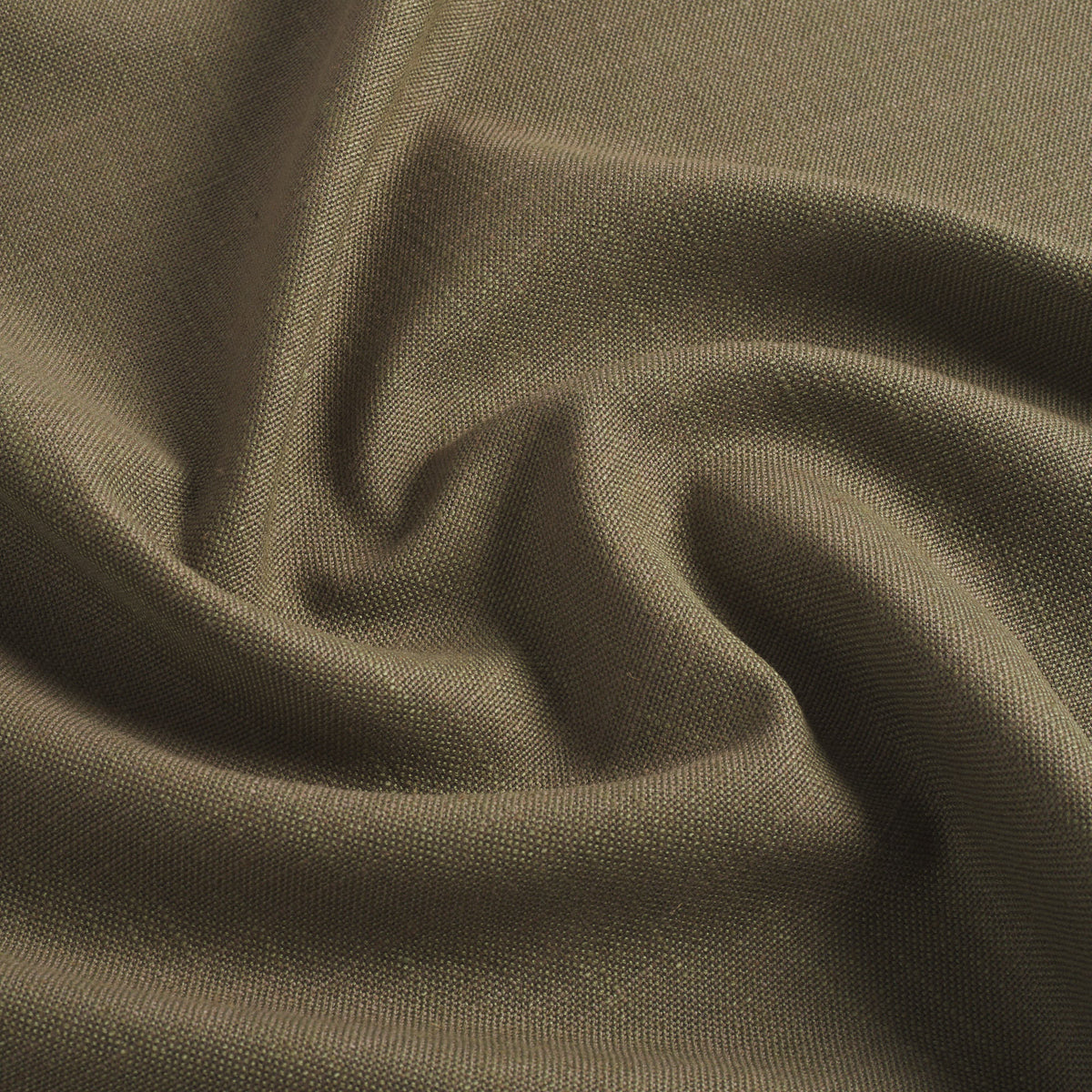 Tonic Living Hampton Moss performance upholstery fabric featuring a linen-inspired texture and earthy green colour.