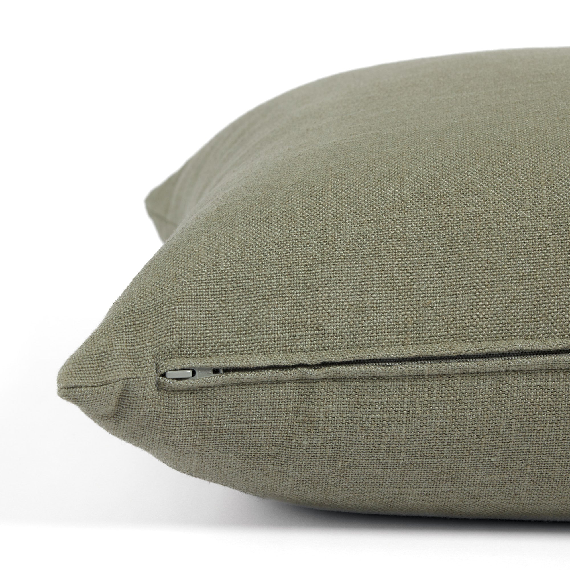 Side zipper detail of Tonic Living Hampton 24x24 throw pillow in muted sage green.