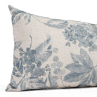 Close-up of Tonic Living’s Heather Indigo lumbar (small bolster pillow), highlighting the botanical print and linen-blend texture in a faded indigo blue and natural beige.