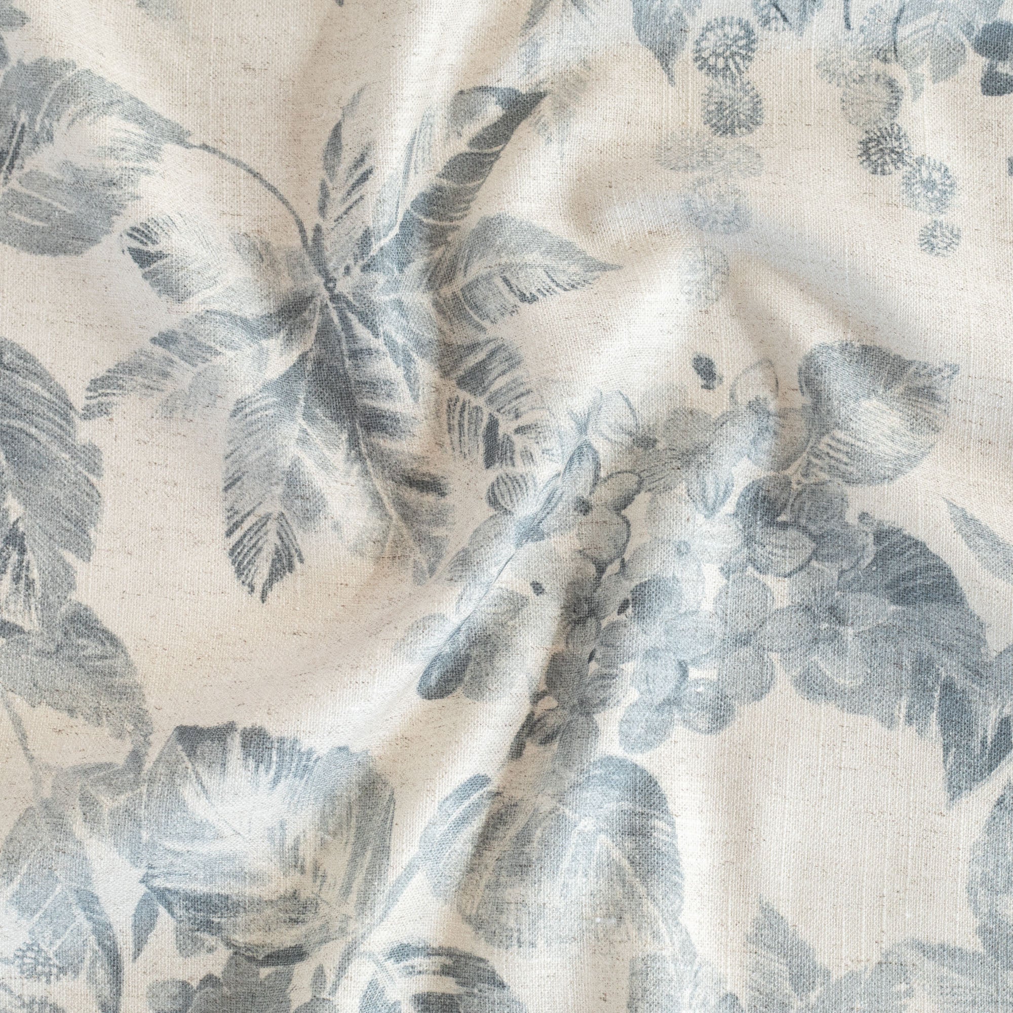 a cream and blue hydrangea floral pattern print fabric 