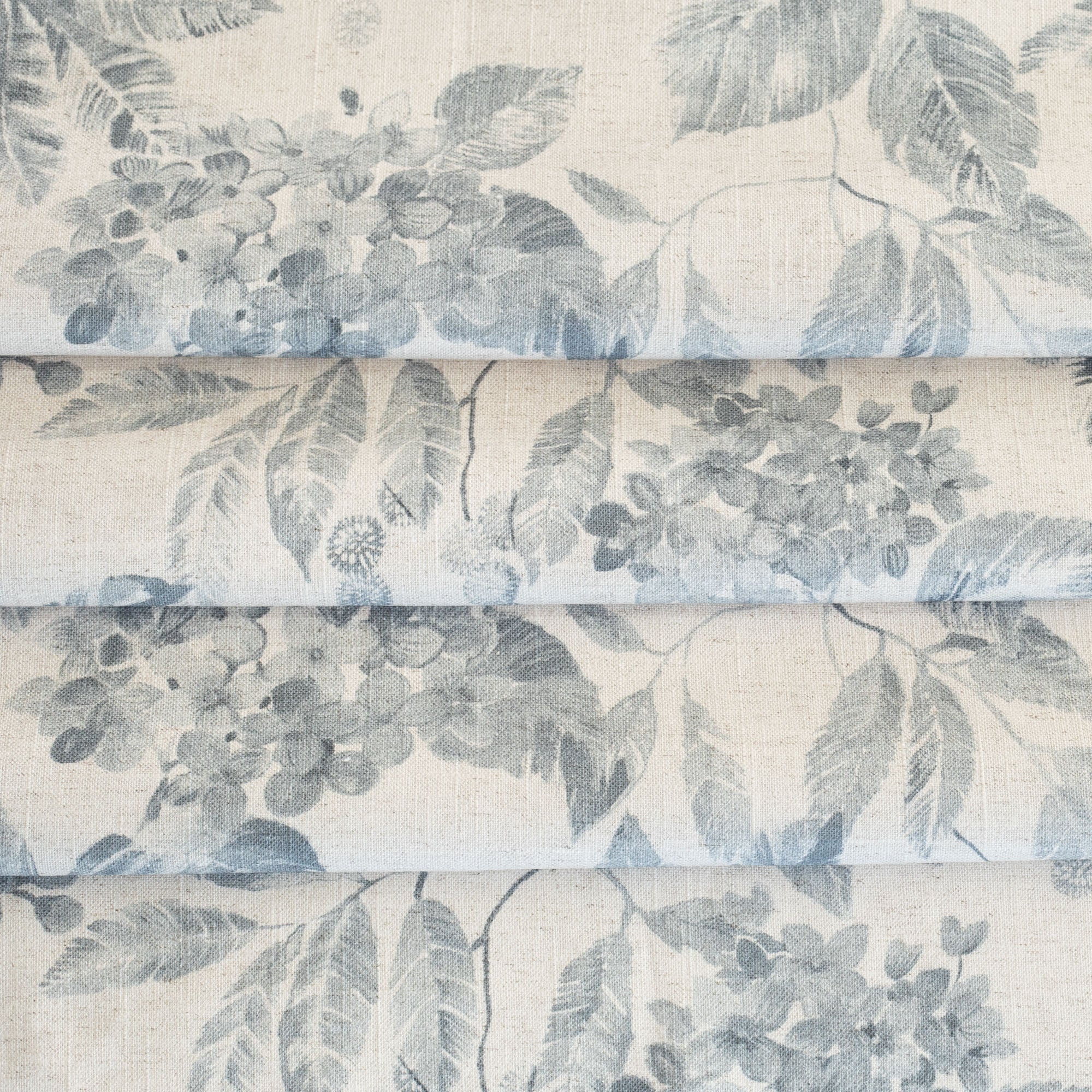 a cream and indigo blue floral pattern print home decor fabric