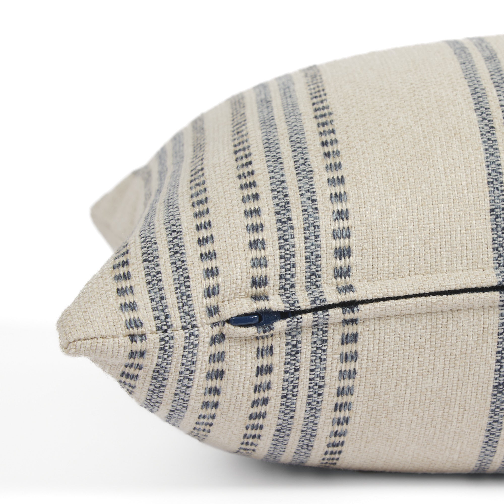 Side zipper detail of Tonic Living Hopper Stripe 16x42 bolster pillow in blue and tan stripe fabric.