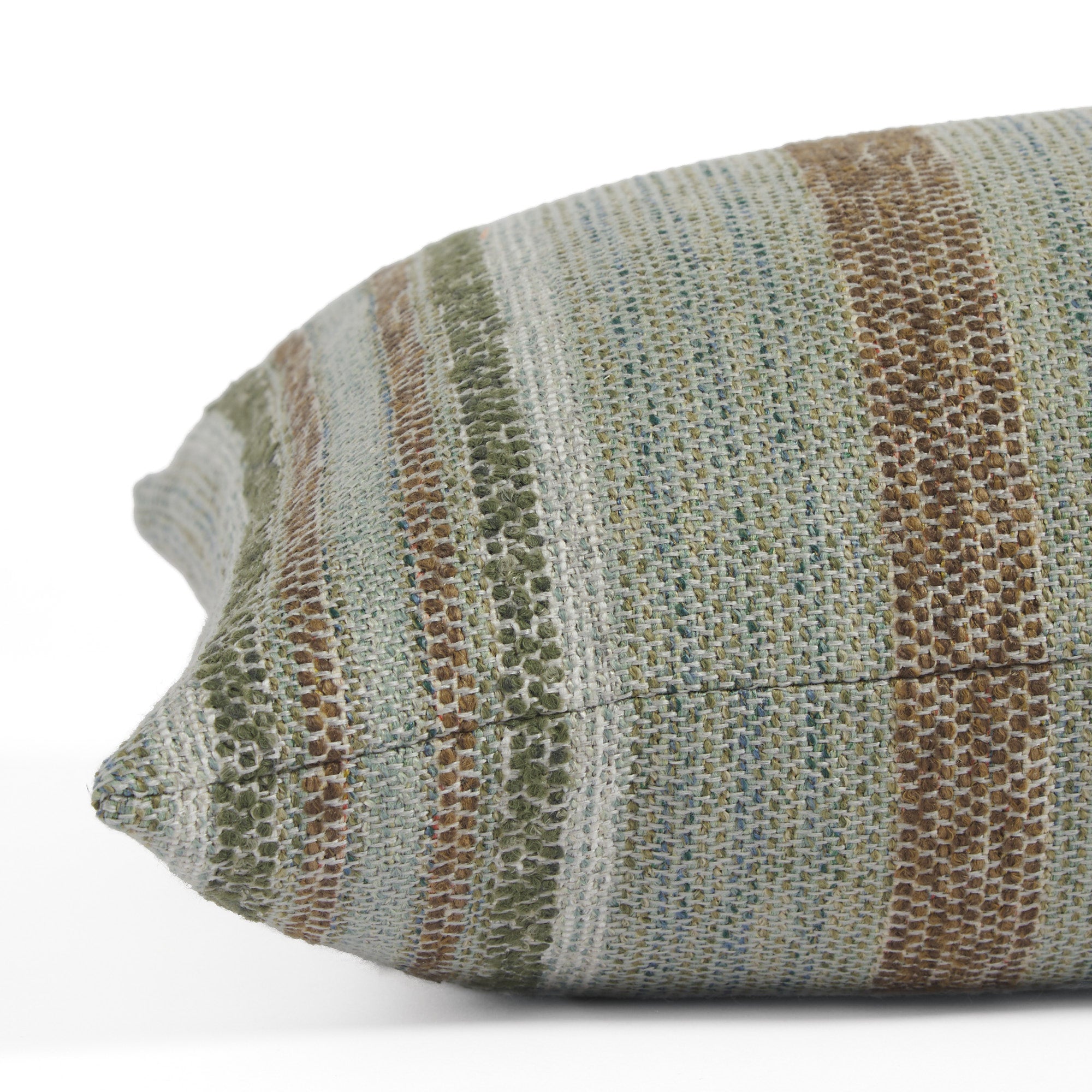 Side view of Tonic Living Indie Stripe extra long lumbar pillow highlighting its layered green and teal stripe texture.