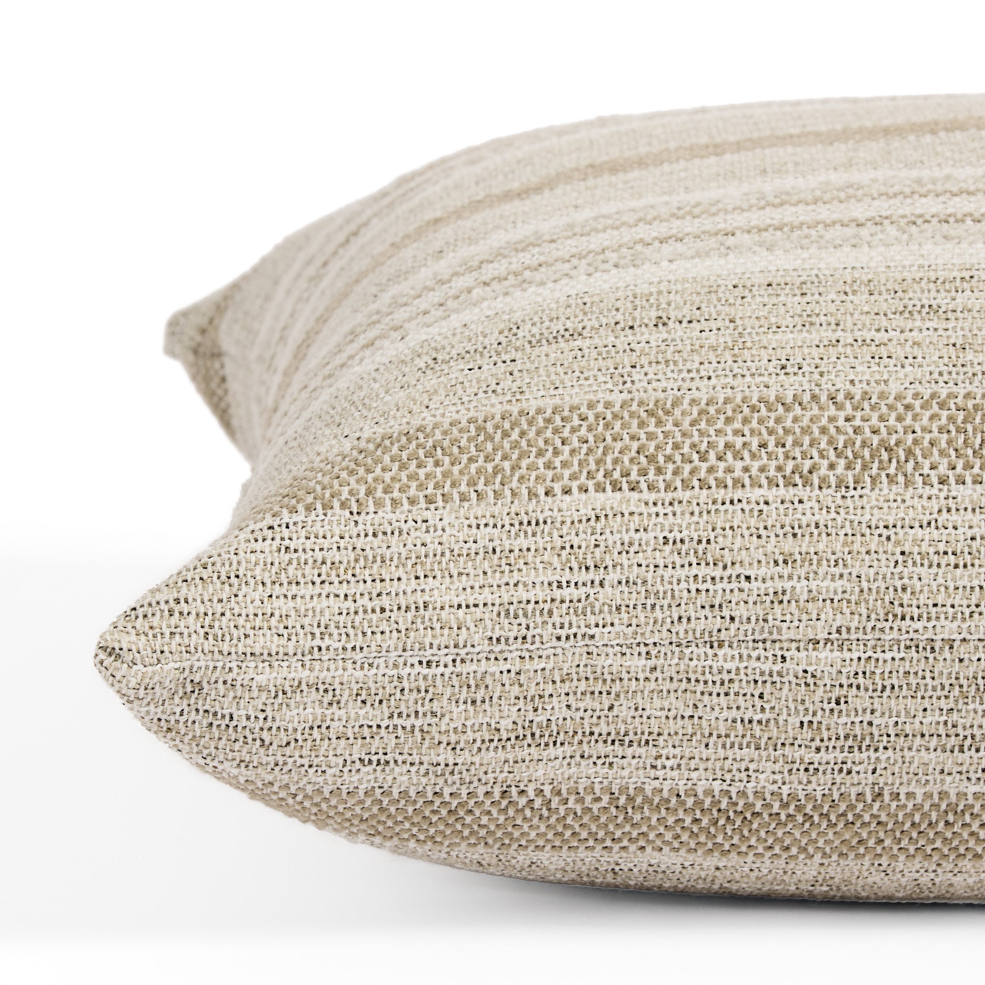 Side view of Tonic Living Indie Stripe decorative cushion highlighting its layered neutral stripe texture.