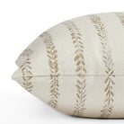 a chestnut brown and cream leaf vine  block print pillow : close up side view