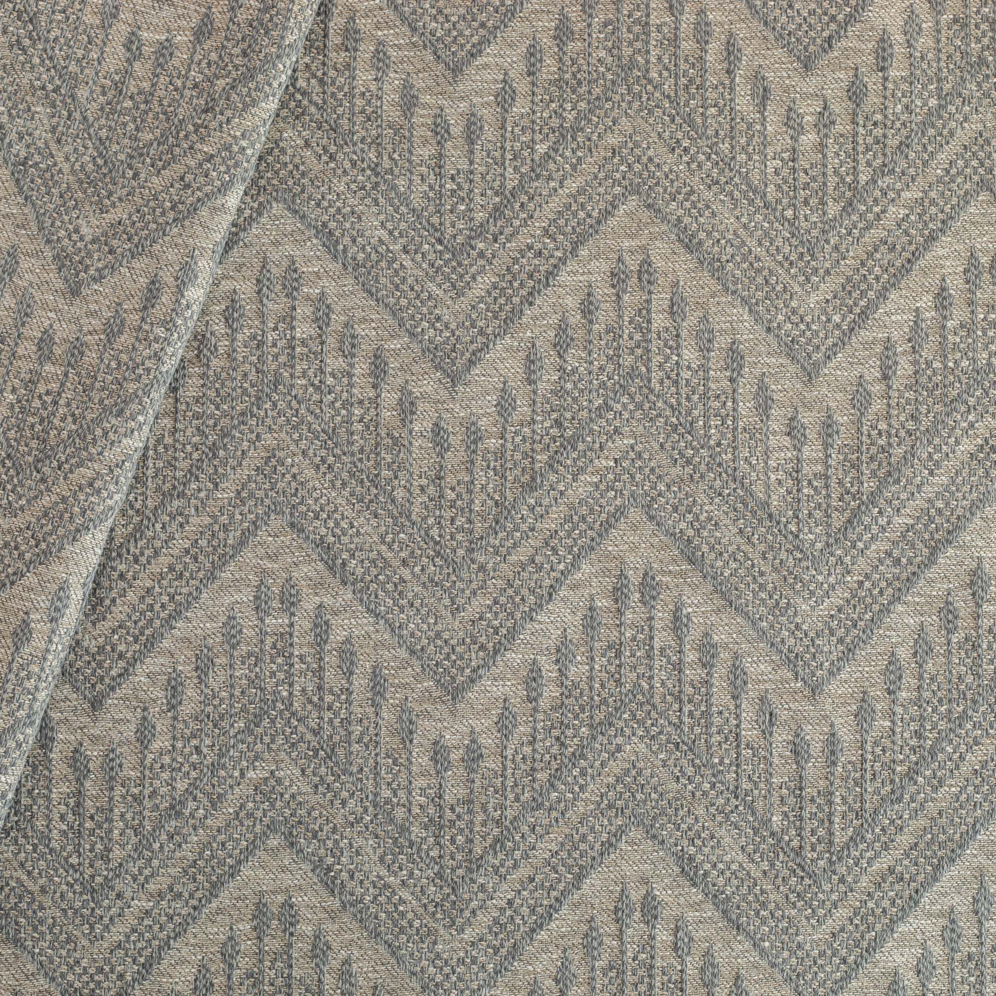 Joyce Fabric denim, a warm grey upholstery fabric with a delicate woven blue geometric zig zag pattern from Tonic Living