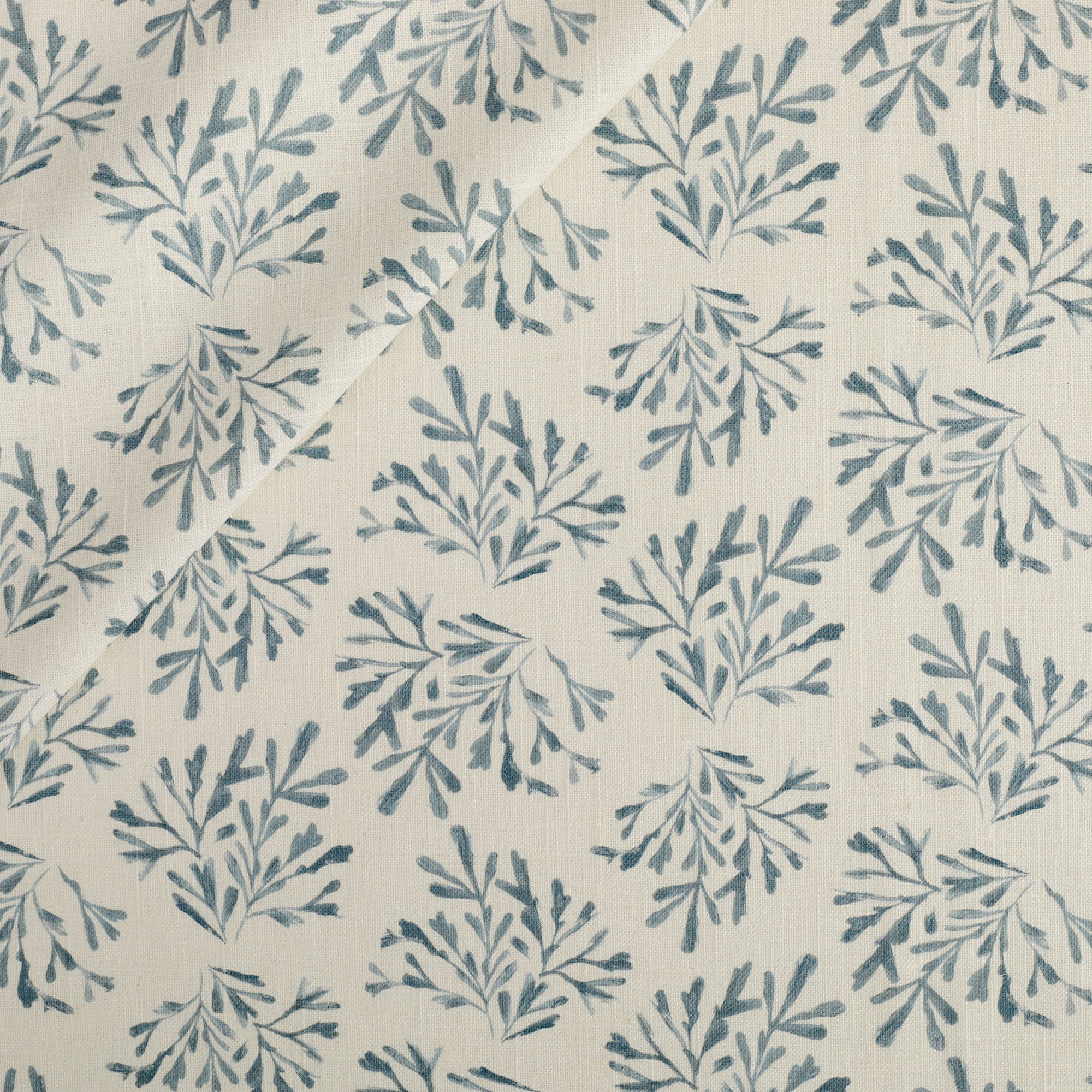 Tonic Living Juniper Fabric in Harbour Blue, a blue and cream botanical print drapery fabric with sprig pattern.