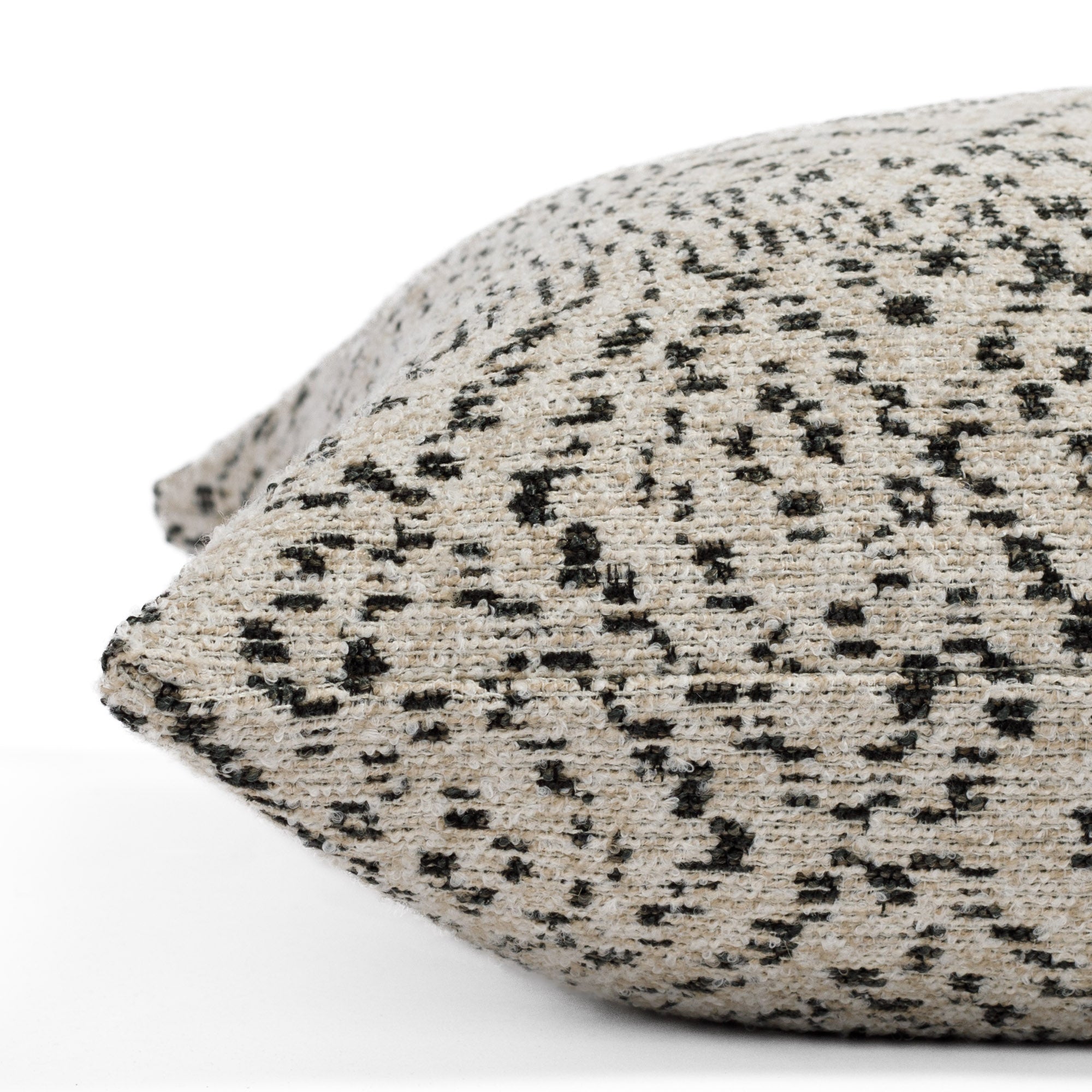 This Khari Black & Natural pillow has an eclectic, global style: close up side view.
