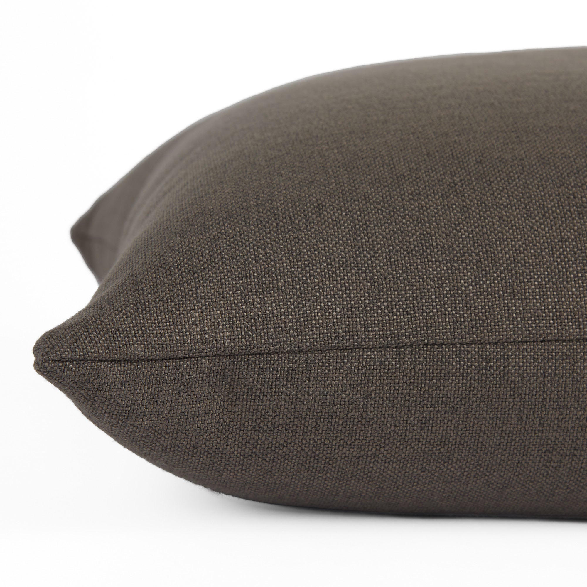 Close-up side view of Loden Mink toss pillow by Tonic Living — smoky grey-brown tone with a soft, organic linen-inspired texture.