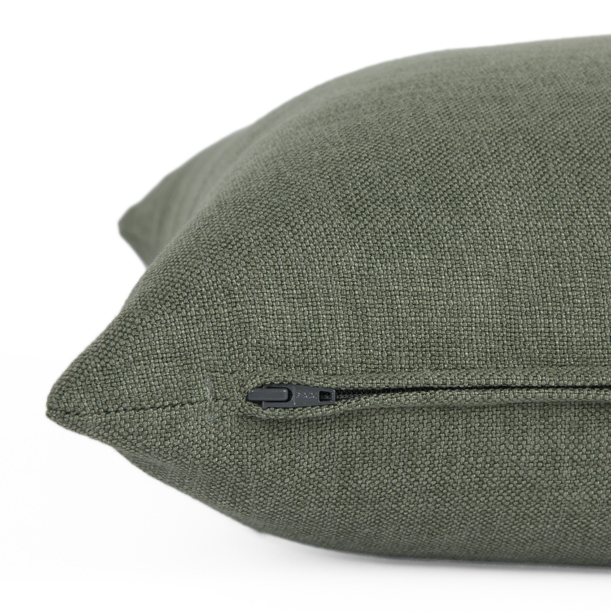Side zipper detail of Loden 22x22 Pillow, Sage by Tonic Living — decorative cushion in muted green with a soft, linen-style weave.